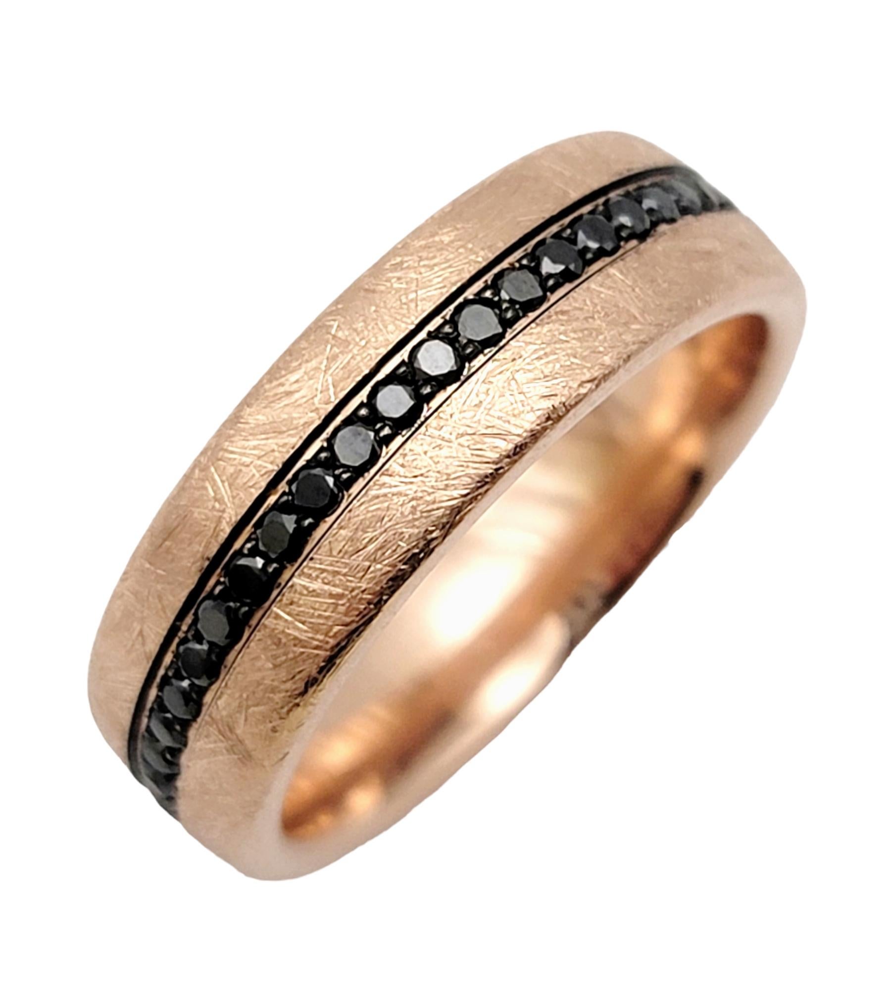 Ring size: 10

Sleek and contemporary wedding band ring designed by Bleu Royale. Beautifully textured rose gold fills the band from end to end while rich black diamonds accentuate the center. A perfectly unique unisex design to say 