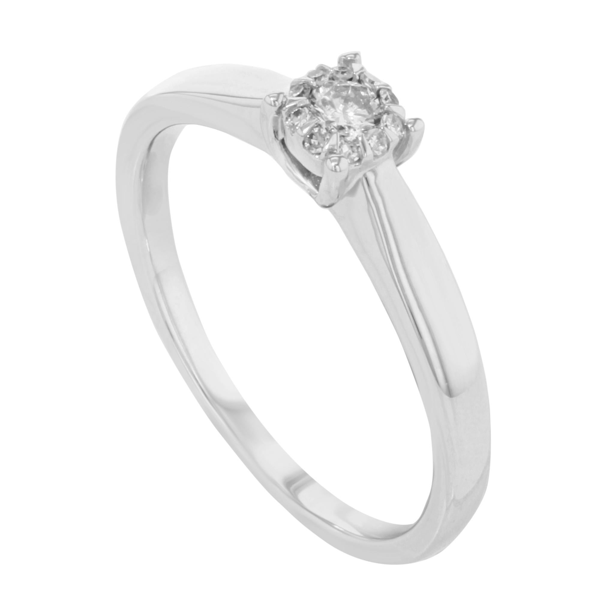 Damiani diamond engagement ring crafted in 18K white gold. Beautiful 0.12cts round cut diamonds. This ring lets you have the experience of a much more expensive diamond ring for a fraction of the price, without sacrificing any of the beauty.