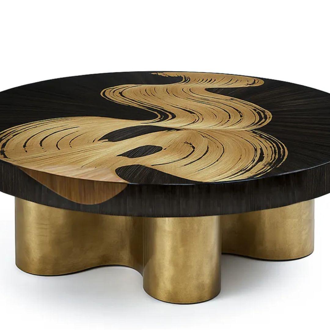 The Bliss Coffee Table combines artistic flair and refined craftsmanship, featuring sweeping patterns in black straw marquetry atop a fluid matte brass base. A sculptural statement piece for elegant modern interiors.

As Shown
Top: Straw Marquetry