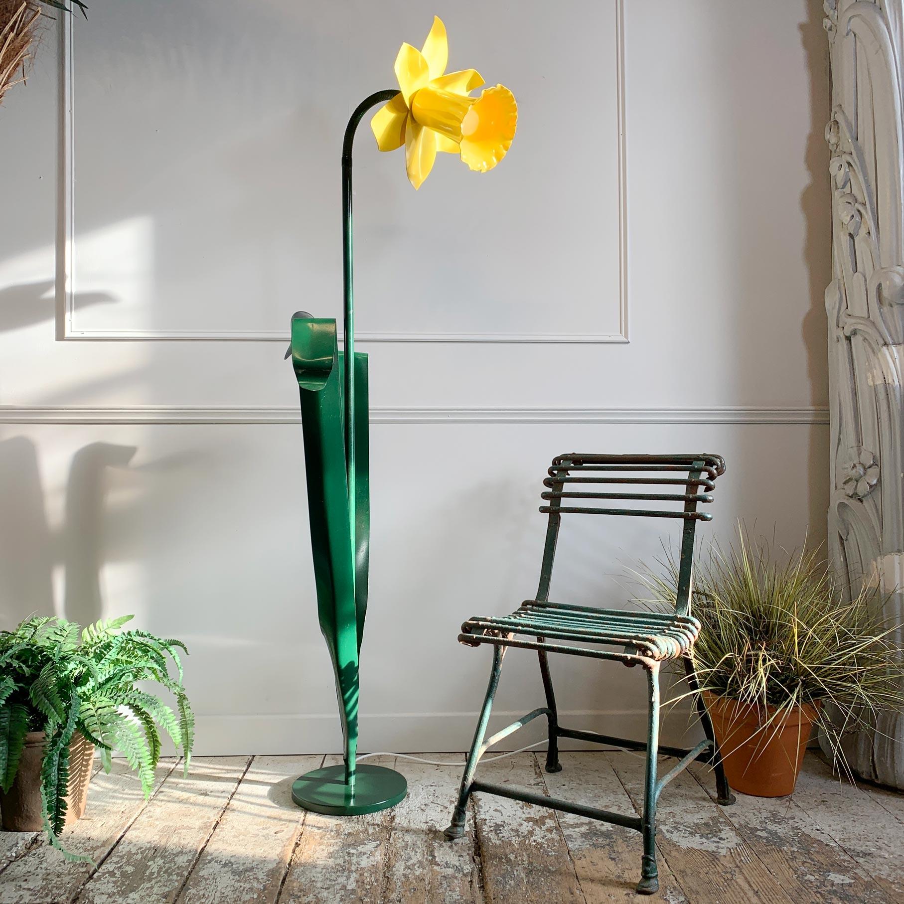 A very large and rare bliss daffodil floor lamp.

Iconic bright yellow daffodil floor lamp designed by Mike Bliss 1985. This adjustable neck designer lamp in painted steel is from the UK and is in very good vintage condition.

Some marks to the
