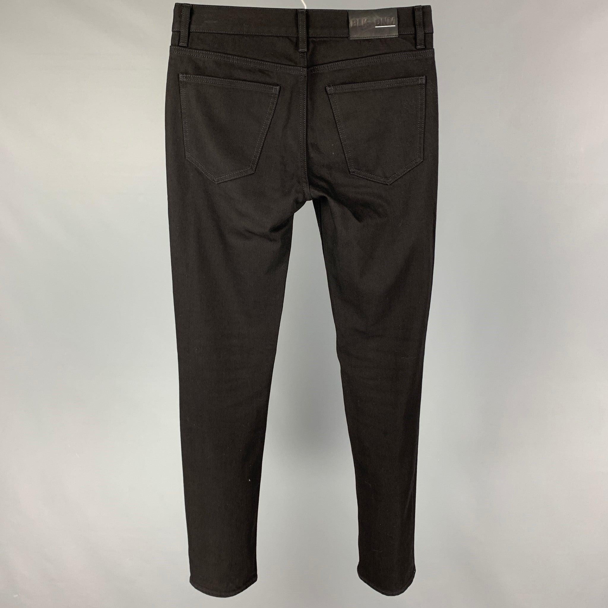 BLK DNM jeans comes in a black cotton featuring a slim fit and a zip fly closure.
 Very Good
 Pre-Owned Condition. 
 

 Marked:  31/34 
 

 Measurements: 
  Waist: 32 inches Rise: 10 inches Inseam: 34 inches 
  
  
  
 Sui Generis Reference: 119771
