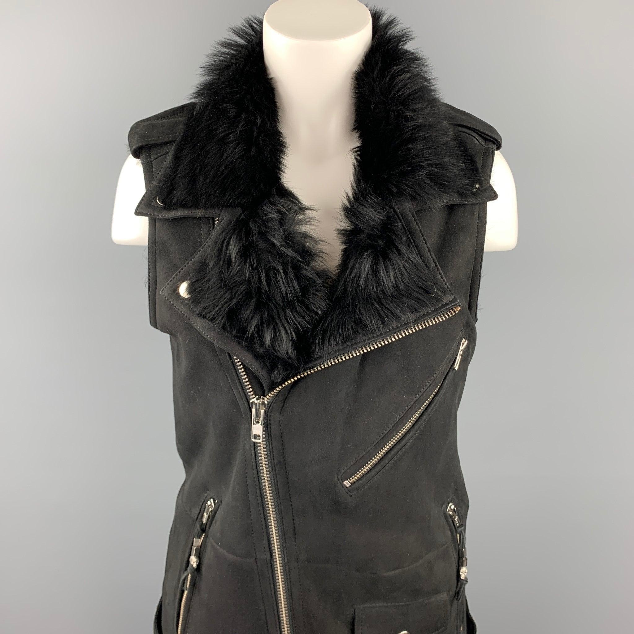 BLK DNM vest comes in a black shearling featuring a biker style, epaulettes, zipper pockets, belted, and a zip up closure.Excellent
 Pre-Owned Condition. 
 

 Marked:  No size marked 
 

 Measurements: 
  
 Shoulder: 14 inches 
 Bust: 34 inches 
