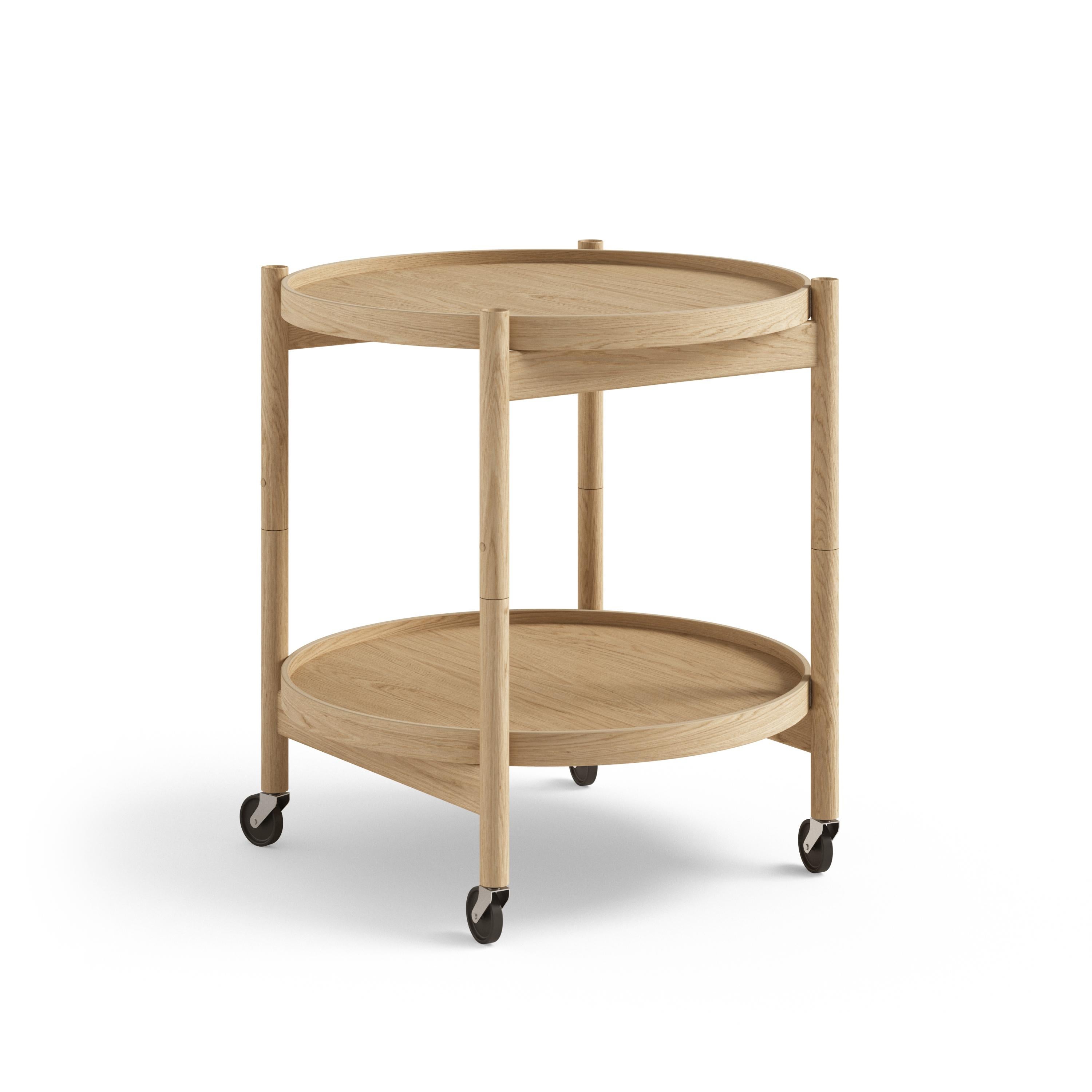 En 1963, el arquitecto danés Hans Bølling diseñó una mesa sencilla, elegante y móvil, fácil de manejar. Desde entonces, se ha convertido en un símbolo del funcionalismo lúdico de la época dorada de la modernidad danesa, y en una idea de diseño que
