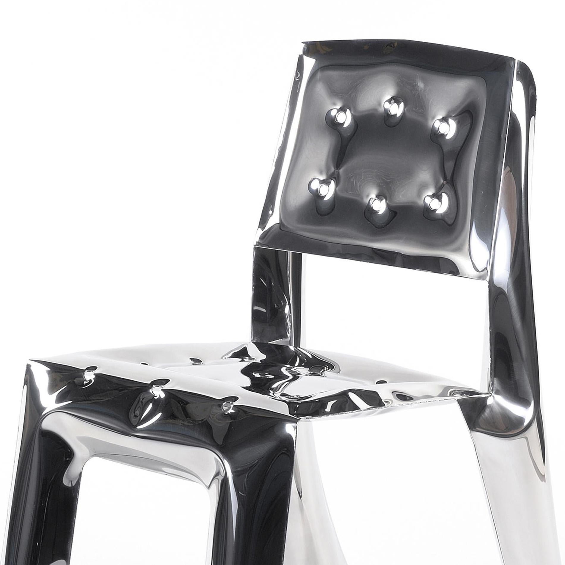 Chair bloat made in polished stainless steel,
using bending properties of steel sheets.