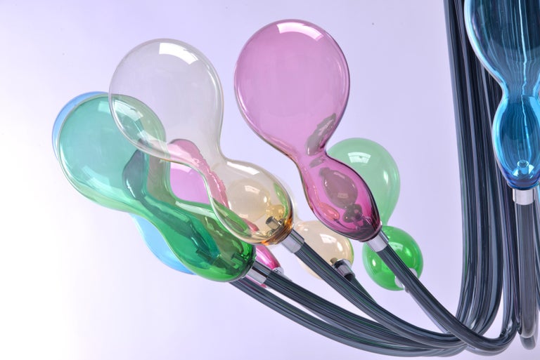 21st century Karim Rashid chandelier Blob 8-light Murano glass various colors.
The lighting parts of Blob seem to be light balloons suspended in the air, a fresh look for this new generation chandelier designed by Karim Rashid for Purho proposed in