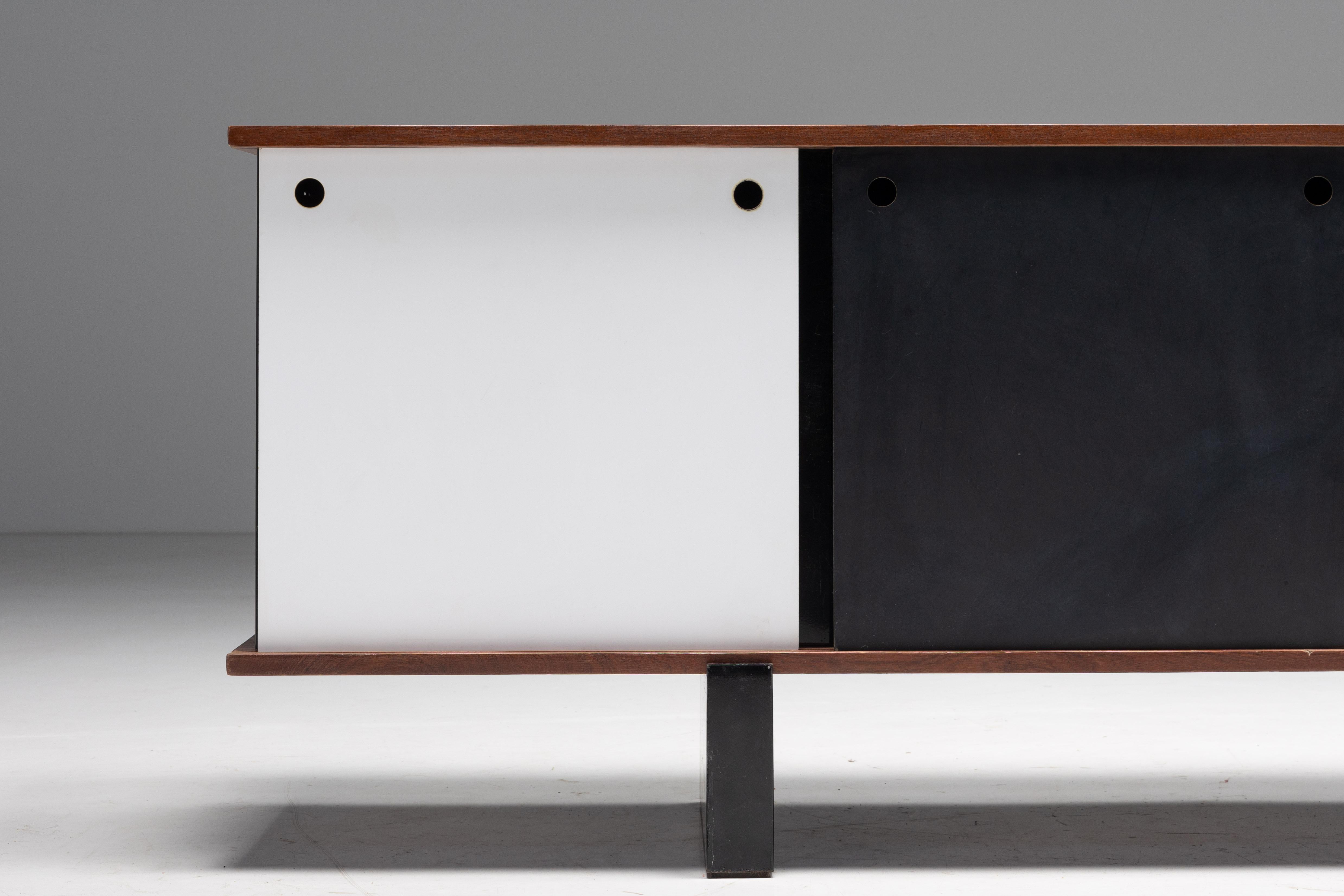 Minimalism; Modernism; Midcentury Modern; Simplicity; Charlotte Perriand; Cité Cansado; 1958; 1950s; France; 

Sideboard 'Bloc' by Charlotte Perriand, a timeless piece designed for Cité Cansado. Composed of sturdy coreboard shelves veneered in a
