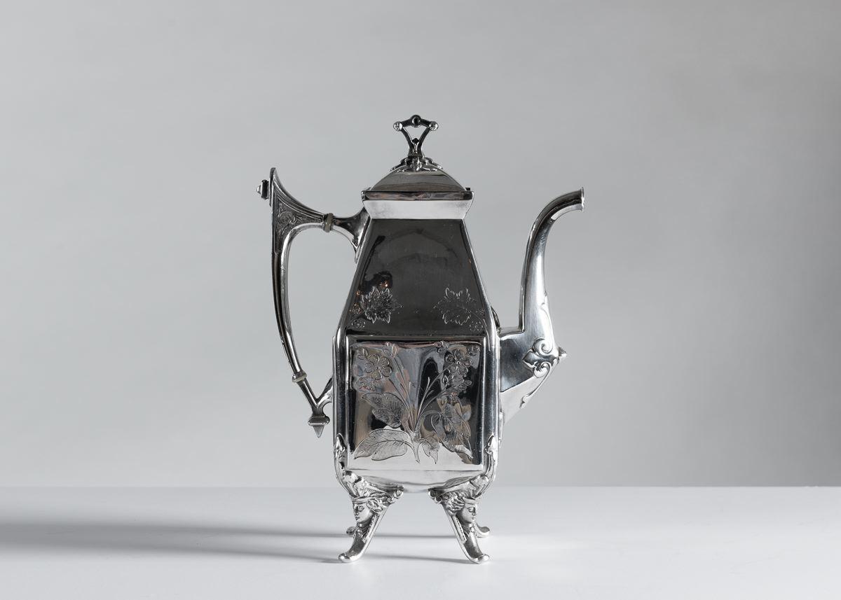 Comprising: teapot, coffeepot, creamer, sugar bowl with cover, slop bowl, and spooner with servant's bell.

Each stamped: MFD & PLATED BY / REED & BARTON / 2585
Each teapot stamped: PATENT APPLIED FOR
Slop bowl and spooner each stamped: PAT. MAY.