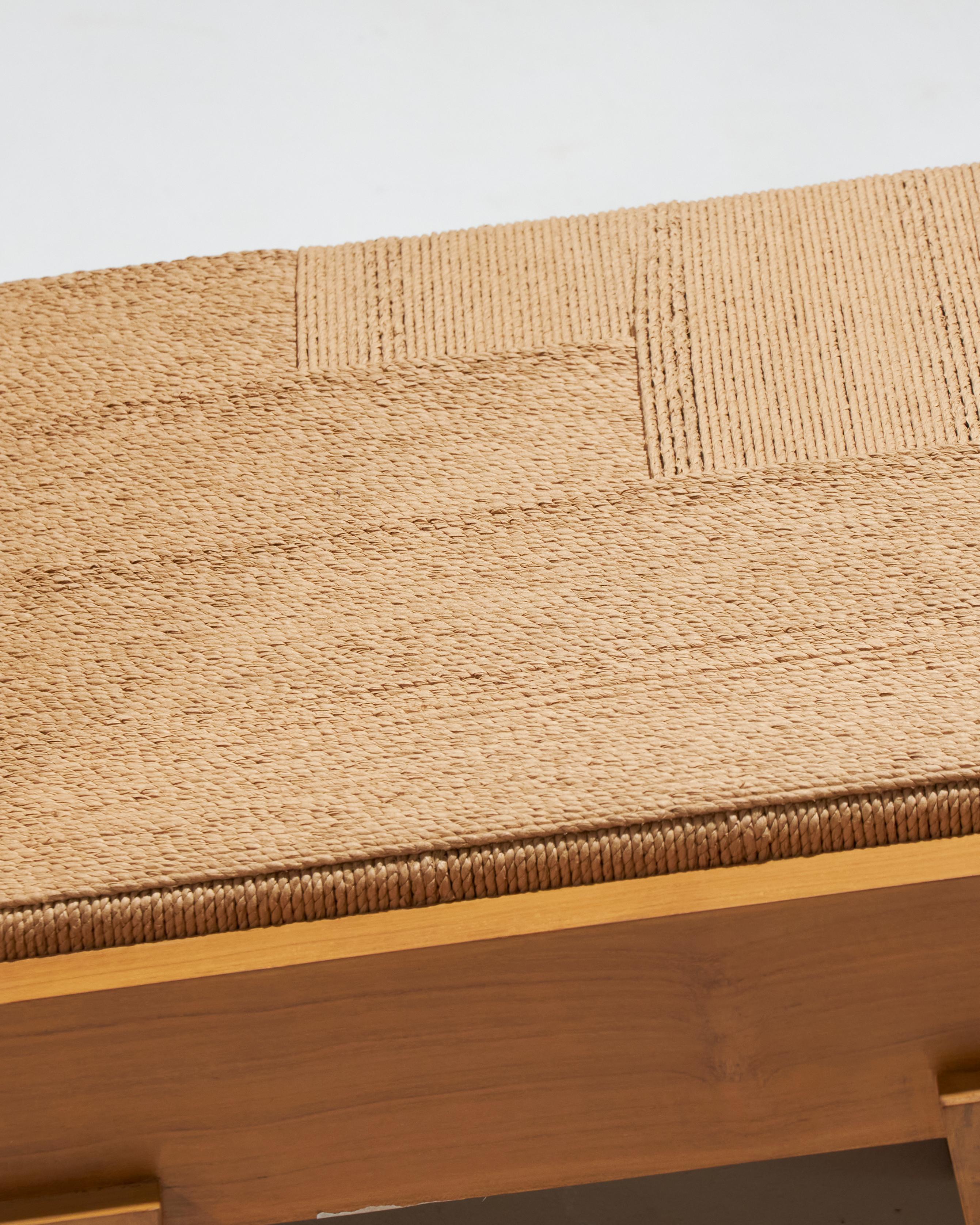The Block armchair is a handcrafted piece made from solid recycled teak. Its seat and backrest, finely woven in loom rope, bring an artistic touch to its functional design. The unique geometry of its legs gives it a sculptural look from every angle.