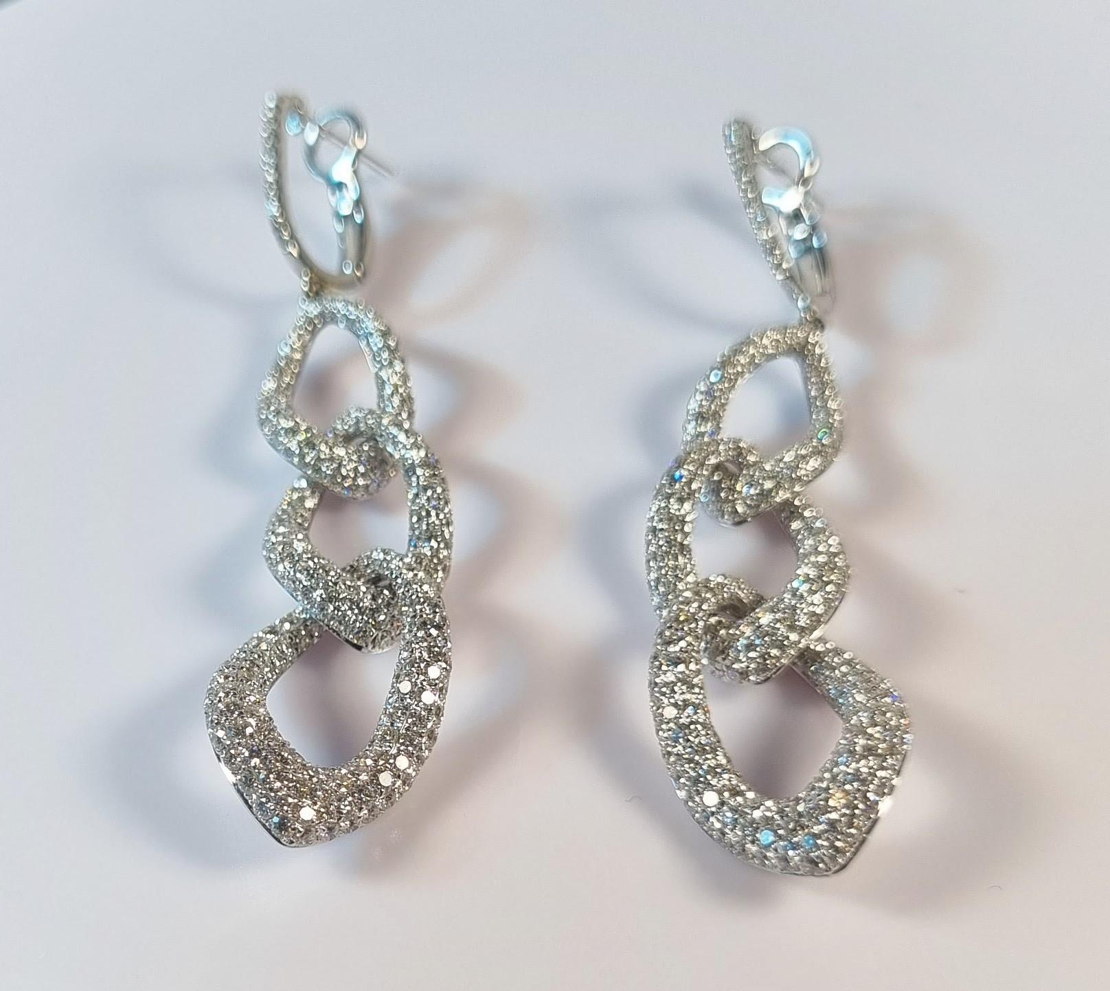 Long earrings in white gold with pavée of diamonds in block chain sequence 
454  Diamonds total 4.43ct.
Diamond Quality  F/G VS
Length 80mm / 3.14in.
Weight 13.66gr total the two
Irama Pradera is a Young designer from Spain that searches always for
