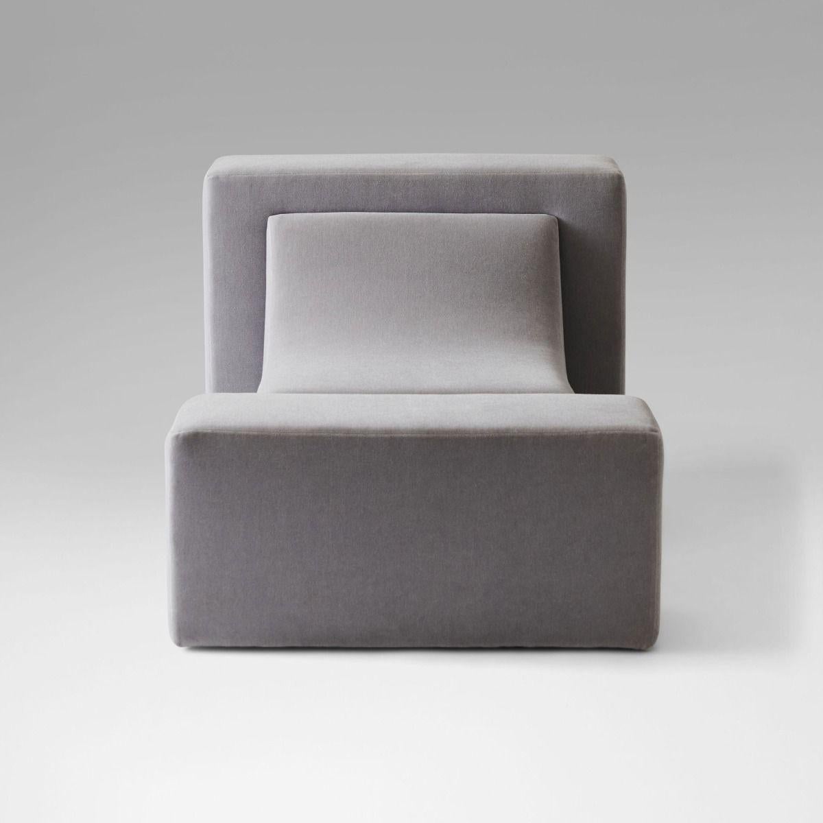 Upholstered lounge chair. Shown in mohair fabric.