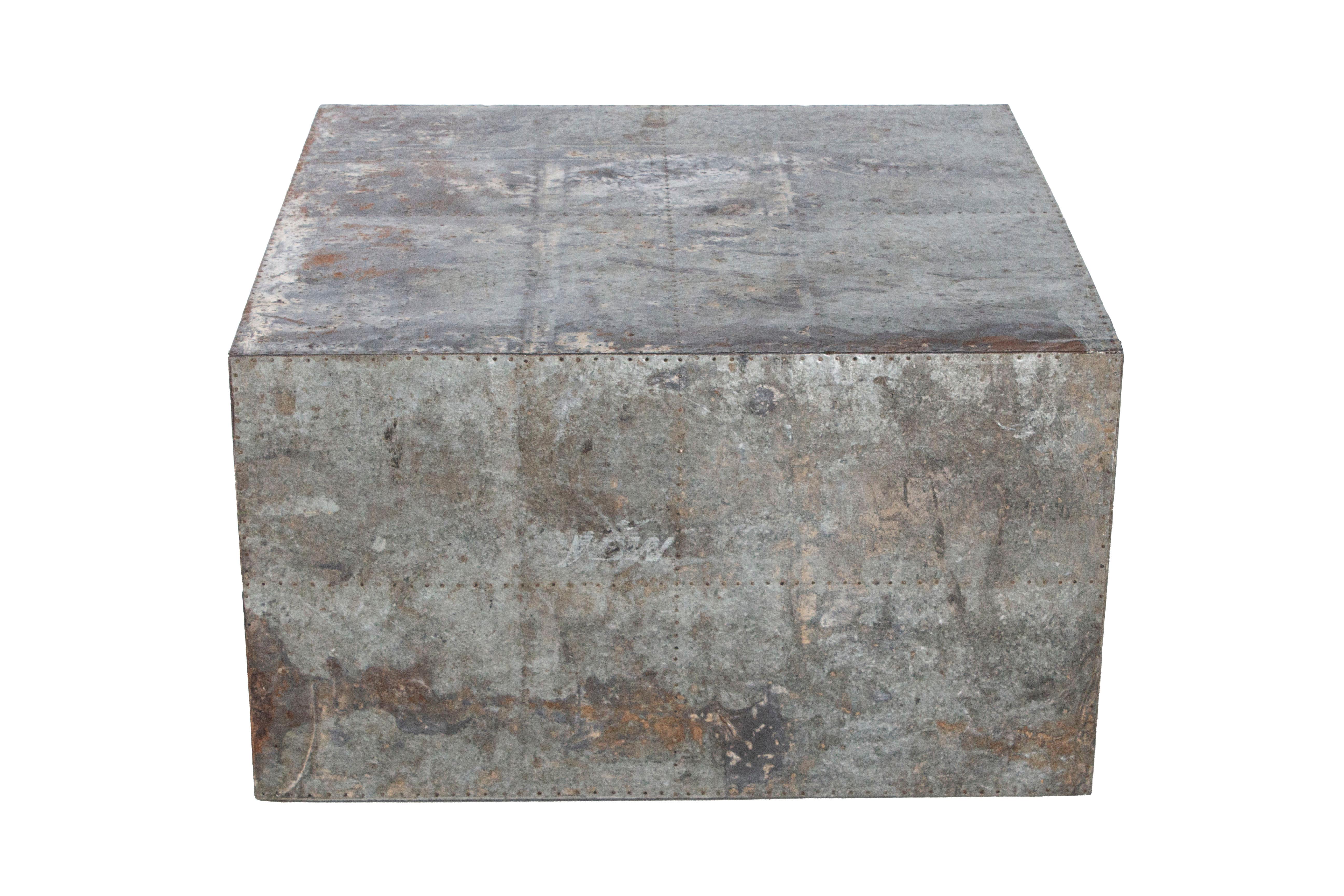 Block form coffee table made from repurposed zinc 

Architectural zinc form used as coffee table.
 