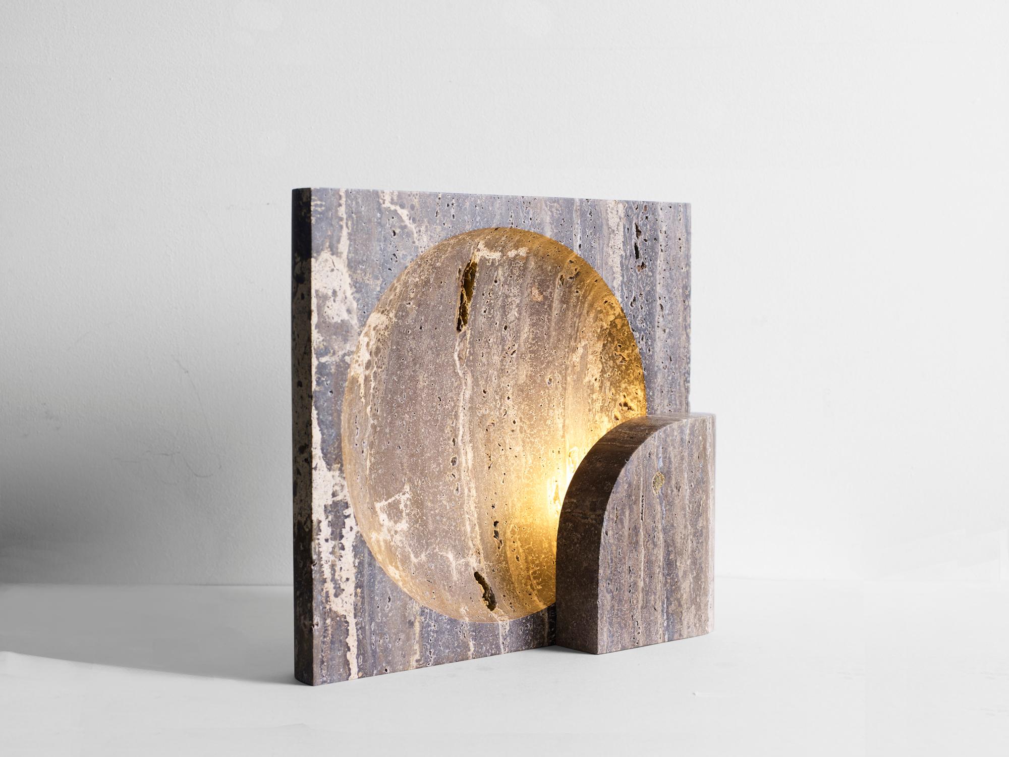 Black Travertine Block Sconce by Henry Wilson
Dimensions: W 35 x D 11 x H 35 cm
Materials: Black Travertine

This sculptural item is handmade in Sydney, Australia.

This block table lamp is an ambient, sculptural light carved in two halves from