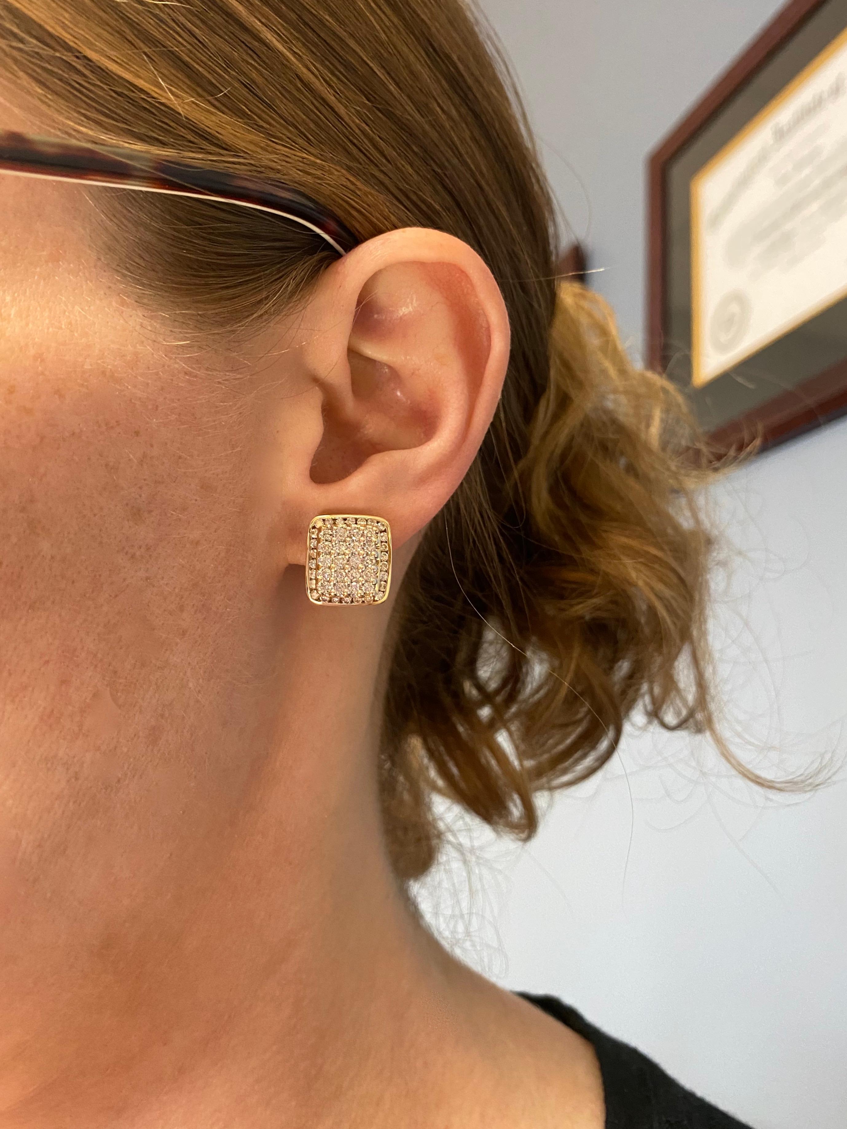 Omega-back diamond cluster block-style earrings in 14k yellow gold. 

Diamond Carat Weight: 2.25CTW
Diamond Cut: Round Brilliant Cut Diamonds
Color: Average F-I
Clarity: Average VS
Metal: 14K Yellow Gold
Marked/Tested: Stamped “14k