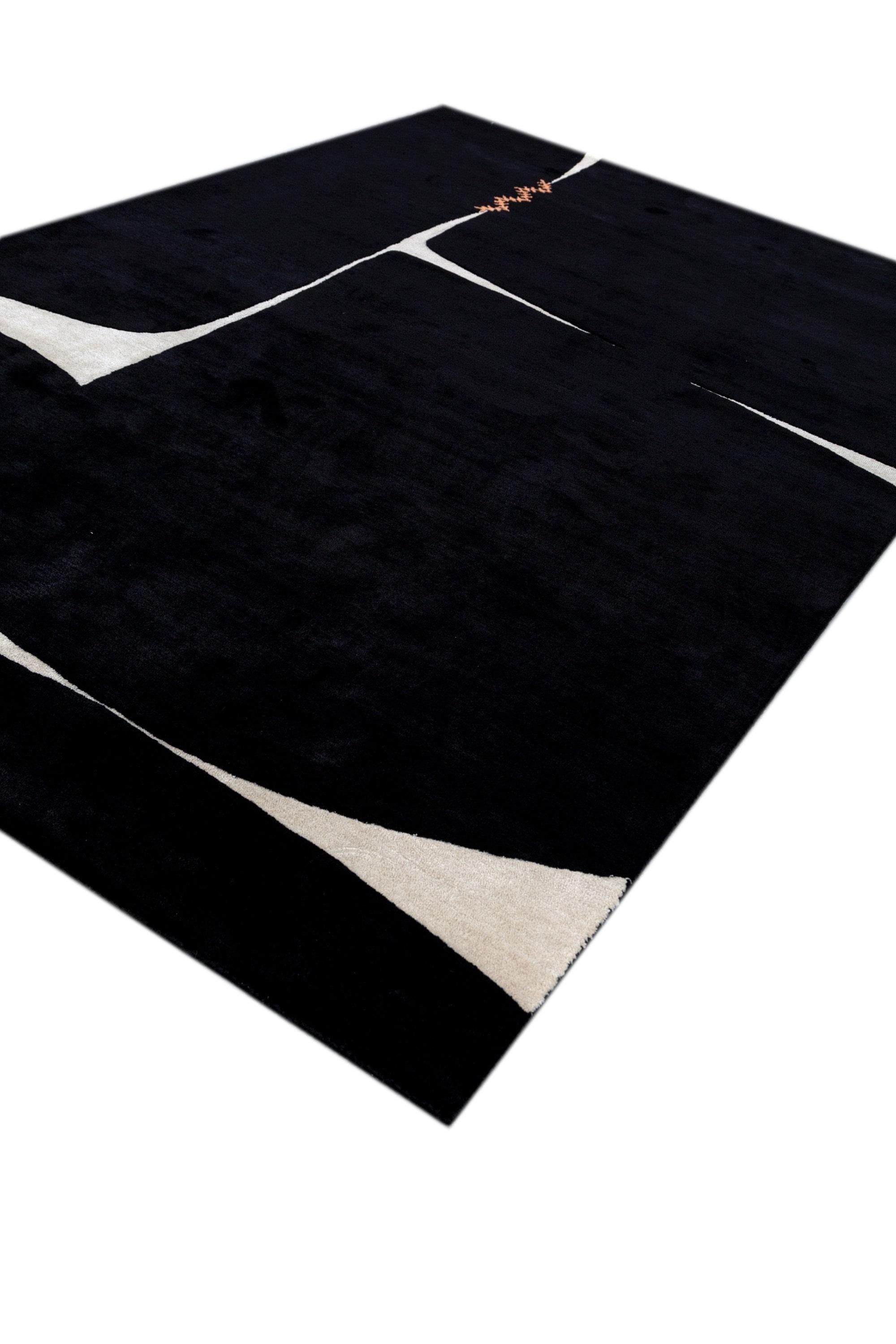 Dieser exquisite, handgetuftete Teppich ist ein Meisterwerk an minimalistischem Design und außergewöhnlicher Handwerkskunst. Er besteht aus einer luxuriösen Mischung aus 60 % Wolle, 20 % Baumwolle und 20 % Viskose und strahlt mit seiner Farbpalette