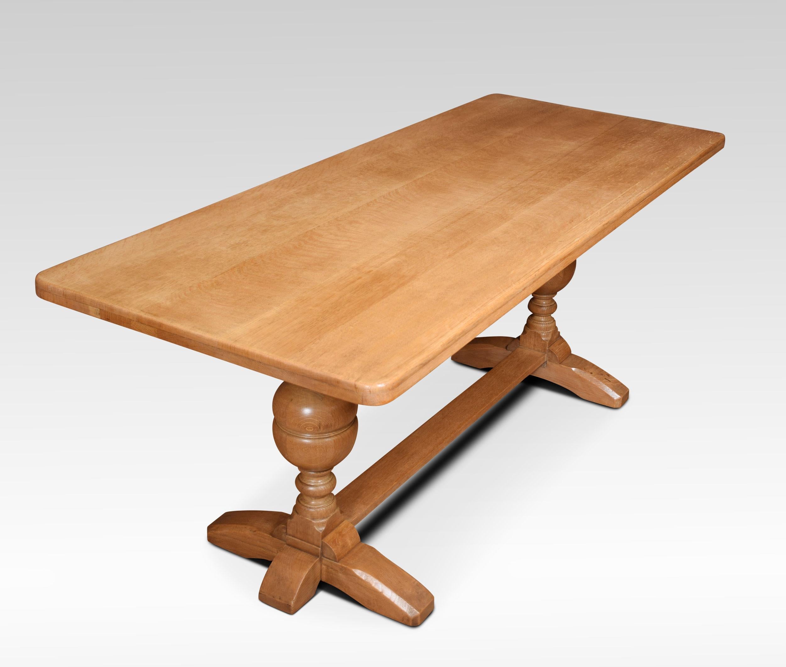 Solid oak refectory table, the rectangular plank top above moulded freeze. Raised up on two-lobed cup and cover supports united by a stretcher.
Dimensions
Height 29 Inches
Width 72 Inches
Depth 29.5 Inches.