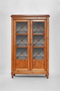 Blond wood cabinet with glass doors, 1970s.