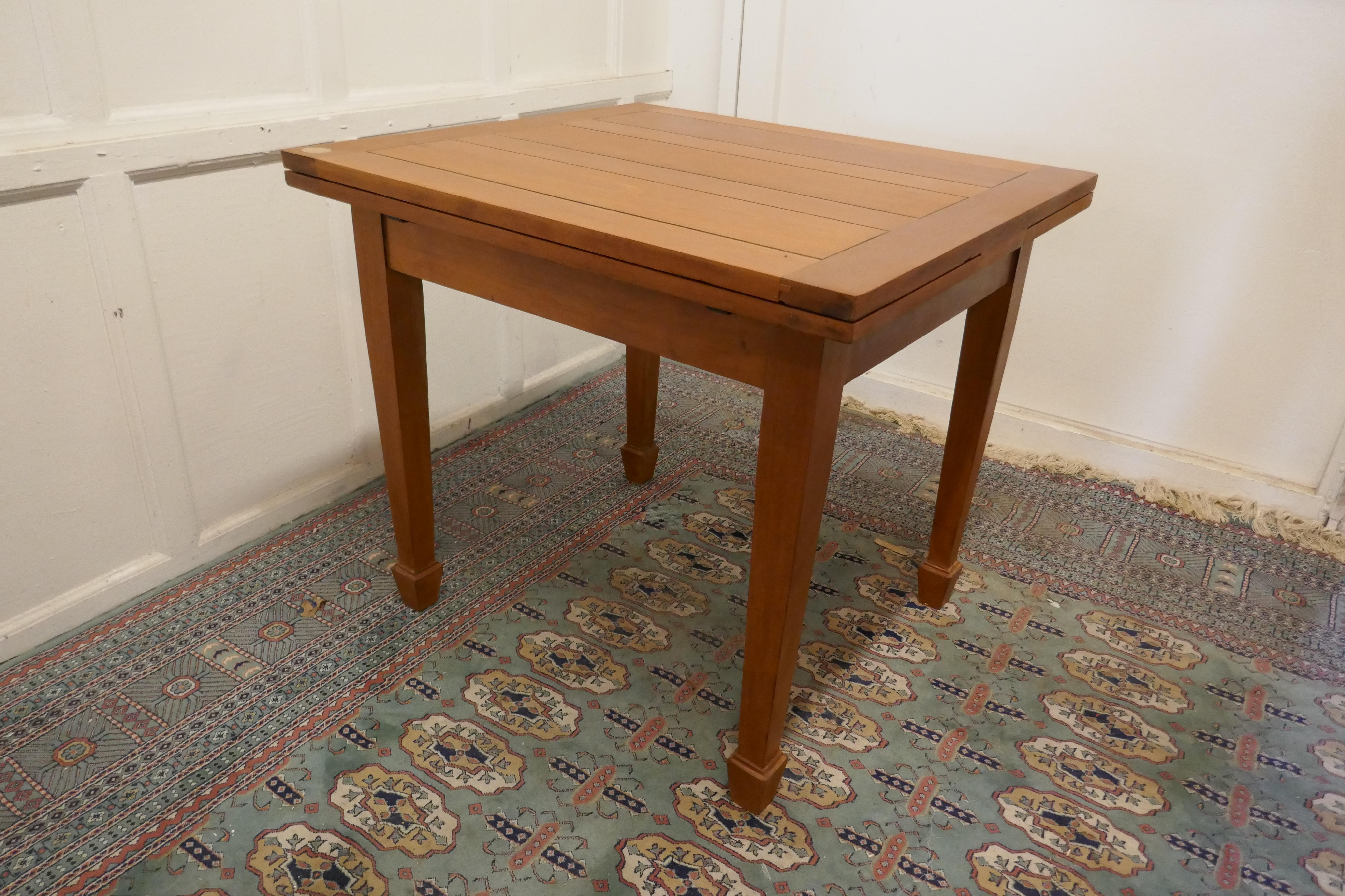 Blonde mahogany cottage draw leaf table

This is an unusual size piece, the square table has a pull out leaf at each end, so in addition to being used for 4 it can also be used as a 8 seat dining table 
The table is in very good sound condition,