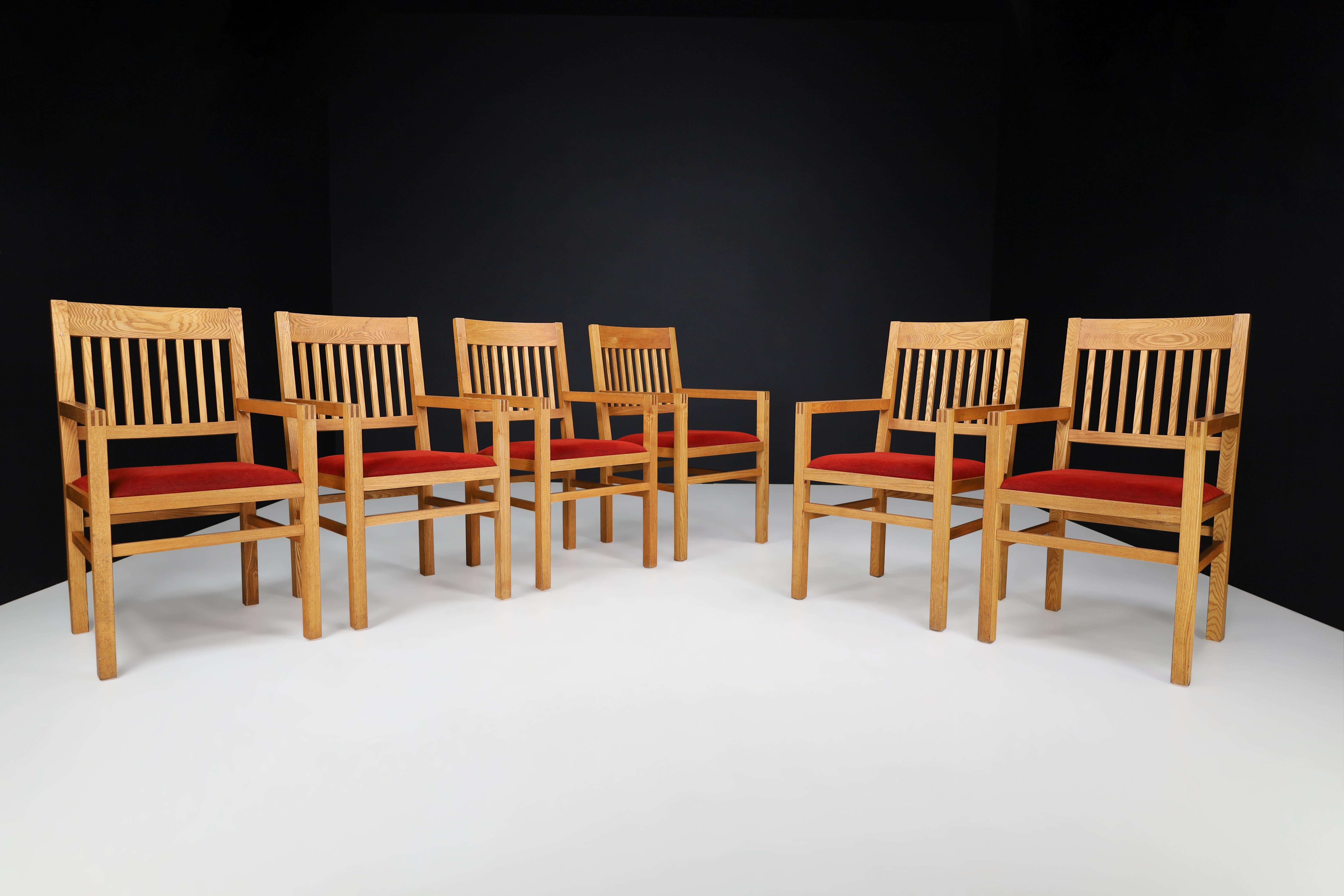 Blonde Oak and Crimson-red Velvet Dining Room Armchairs The Netherlands 1970s 

This dining chair set is an absolutely stunning addition to any home, originating from the Netherlands in the 1970s. The chairs are made from exquisite blonde oak and