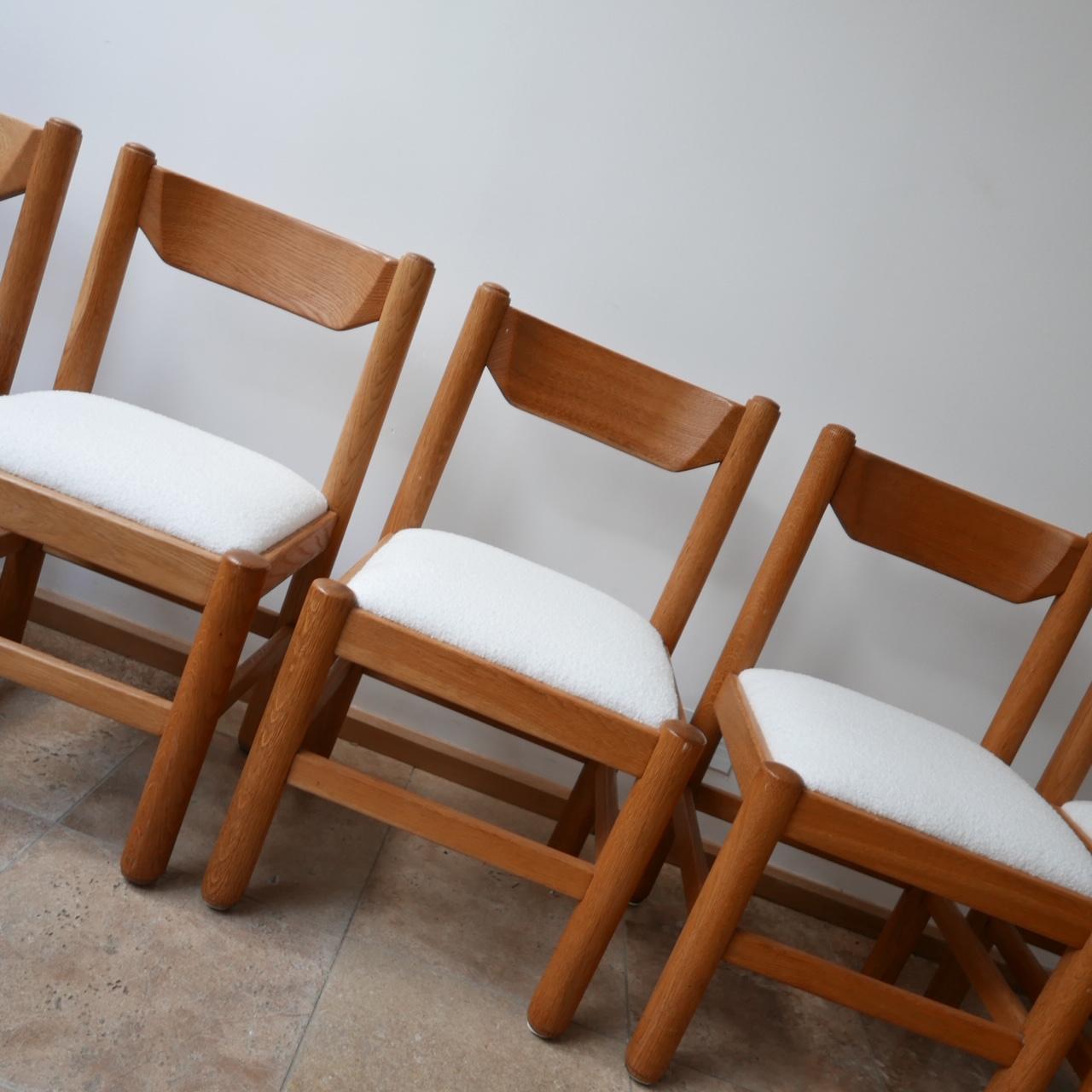 A good quality run of good quality solid blonde oak dining chairs, 

circa 1960s, French. 

Attributed to Guillerme et Chambron. 

Upholstered in good quality boucle fabric.

Dimensions: 50 W x 48 D x 45 seat height x 84 total height in cm.