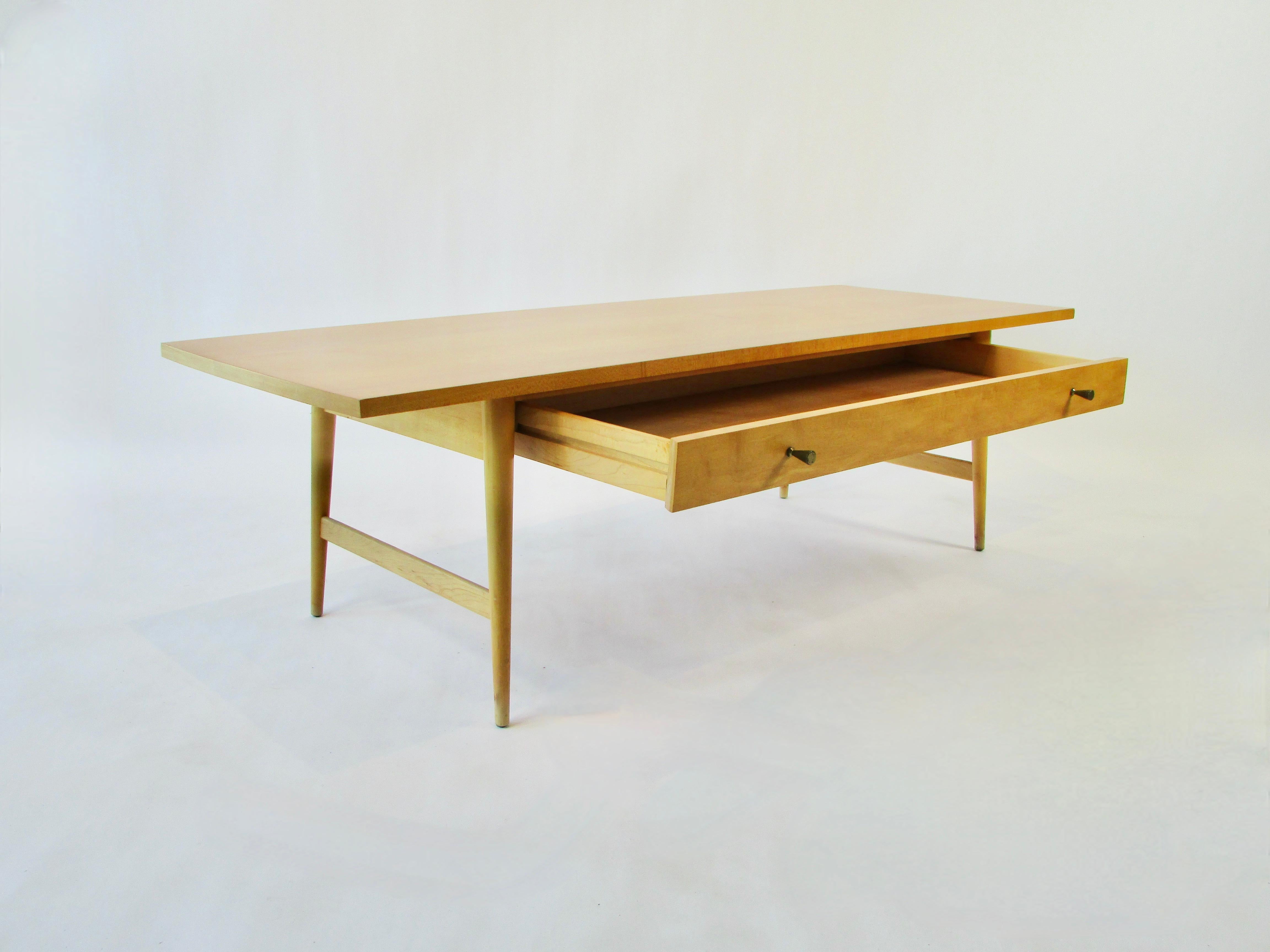 Maybe the cleanest original finish Paul McCobb coffee table I have ever seen. Part of the Planner Group for Winchendon Furniture. One long drawer below nicely grained maple top supported on conical legs.