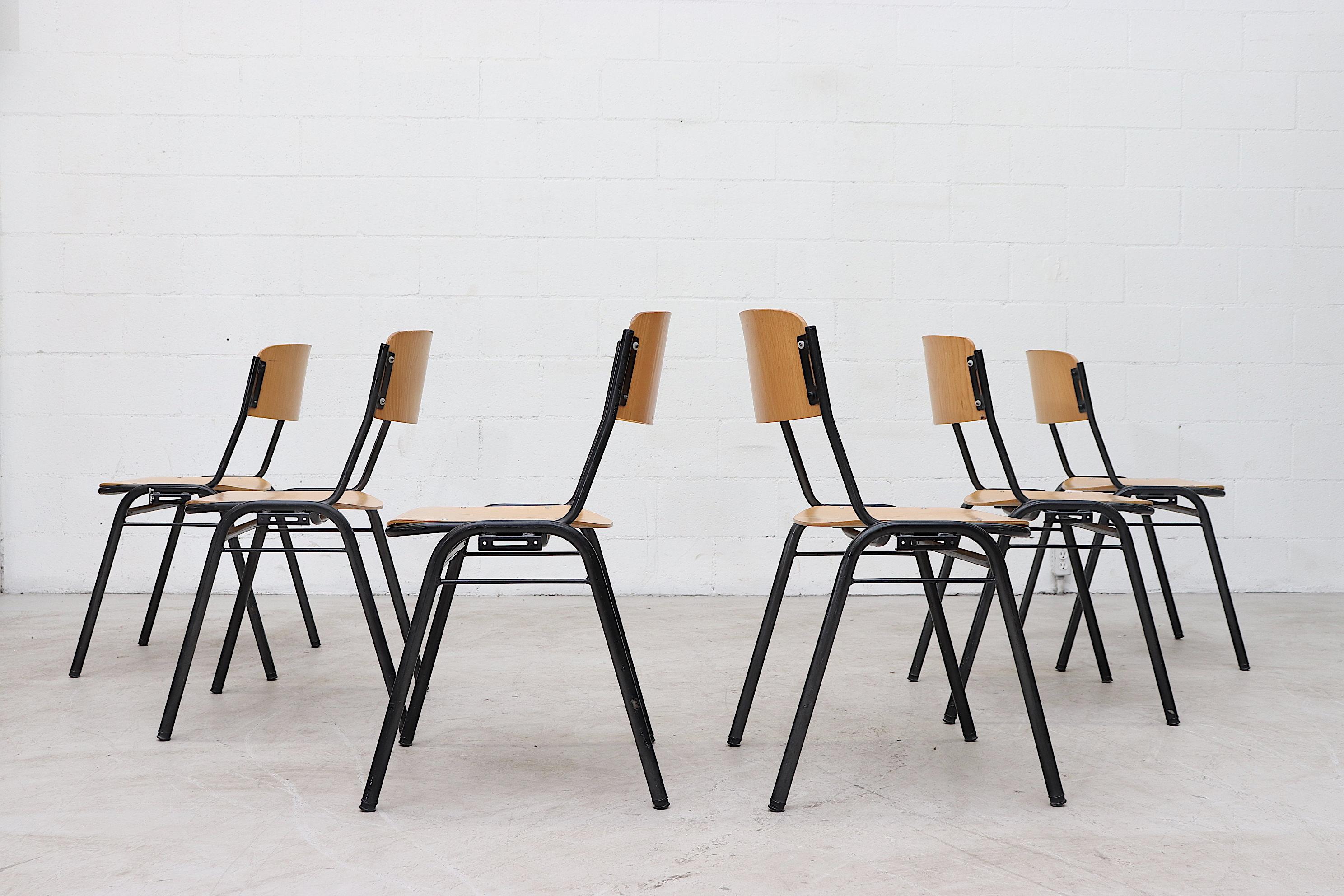 Blonde plywood and tubular enameled metal stacking School chairs. In original condition with visible signs of scratching and wear consistent with age and use. Individually priced.