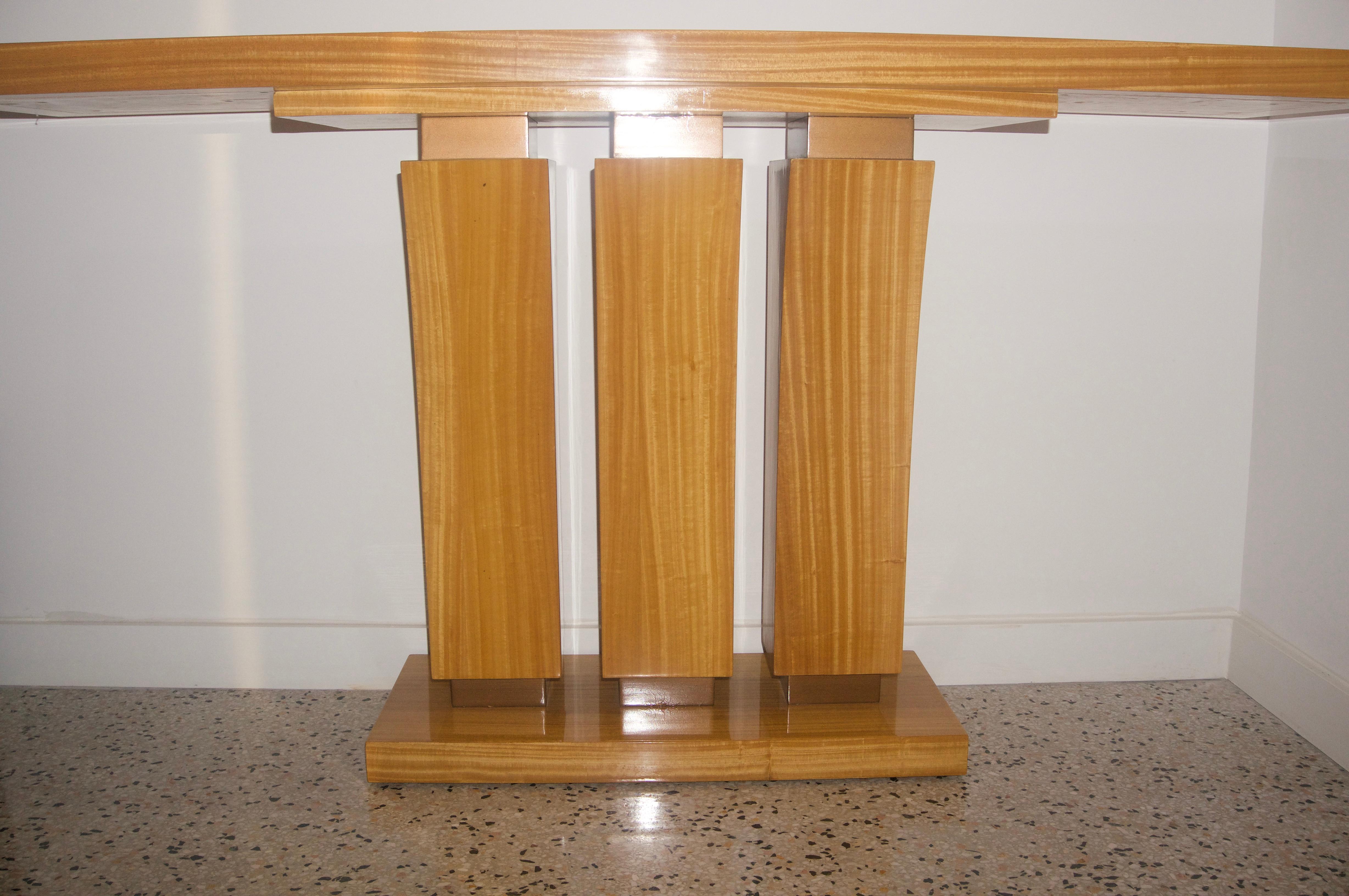 This stylish Art Deco inspired console table in the manner of Karl Springer is fabricated in satinwood with a clear lacquer finish.

Note: We have another of these available if you looking for a pair.