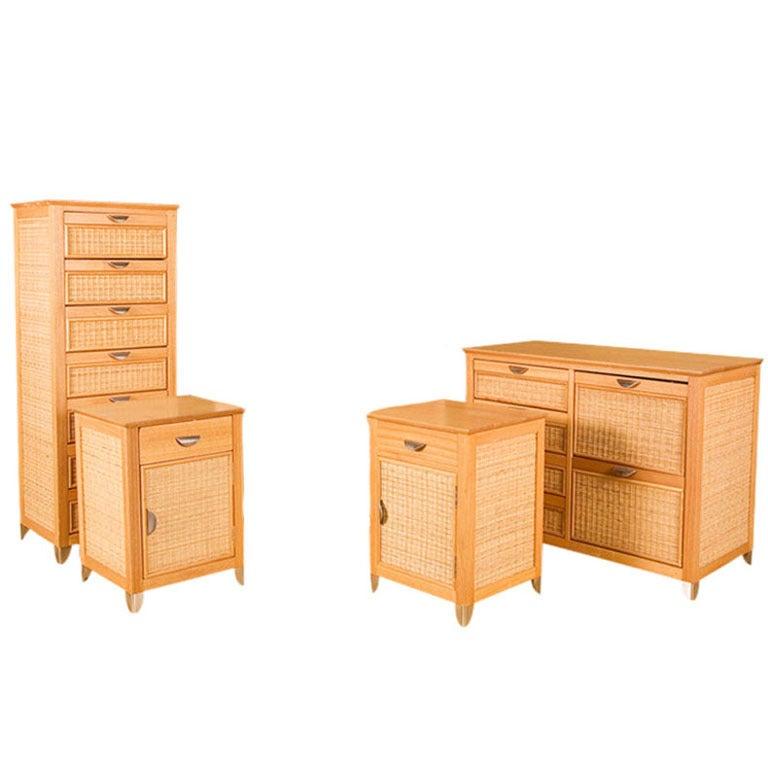 Blonde tropical style bedroom set with pine structure, woven wicker front, and chromed legs and hardware. This set includes two side tables, a lowboy chest of drawers, and a highboy chest of drawers.

Measures: Side tables
Height 24.5.
Width