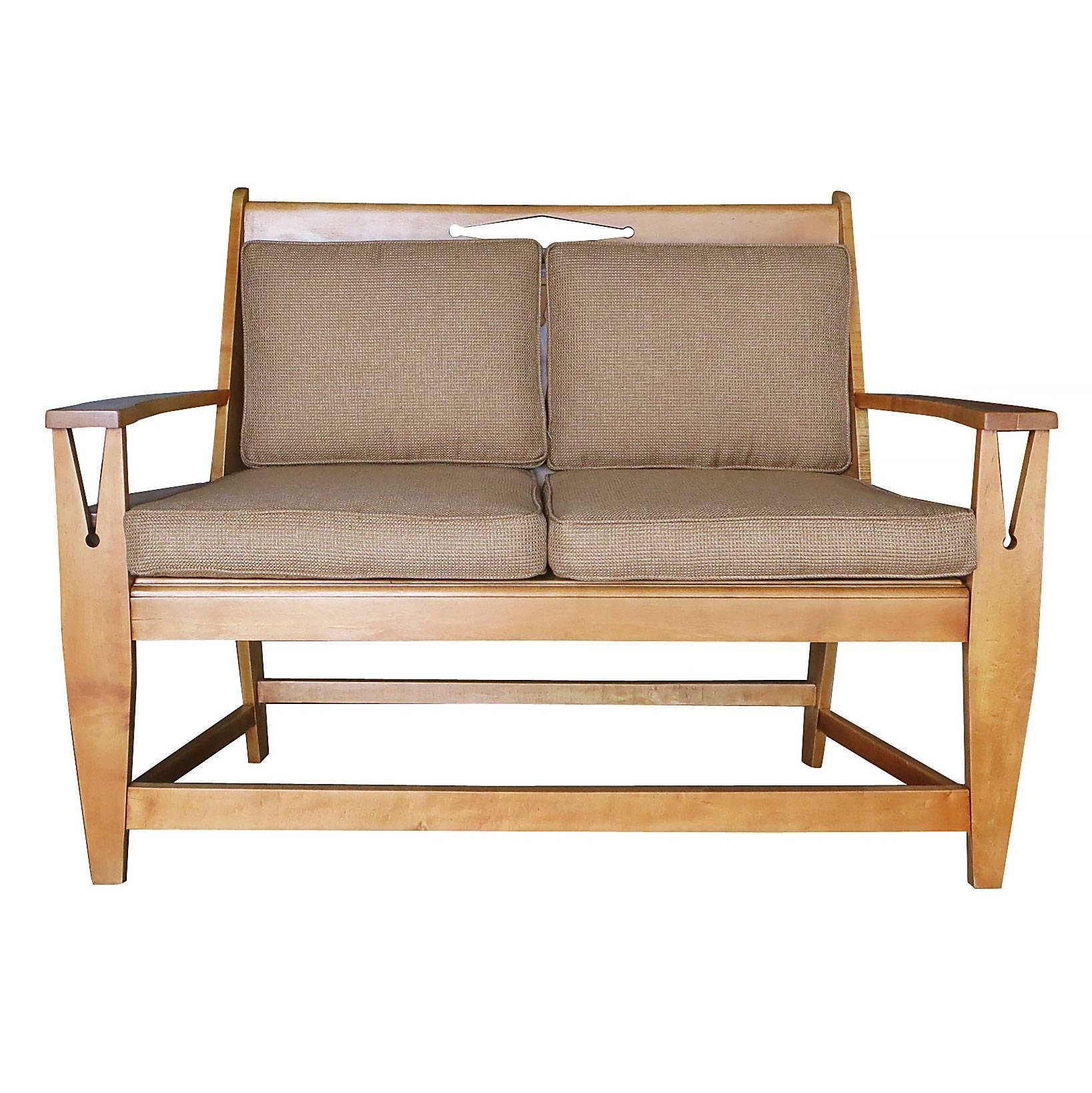 Vintage blonde wood Mission style sofa with clothespin shaped accents along the armrests and back and wicker cane seat in the style of Stickley. Comes with original cushions.

Stickley furniture is renowned for its exceptional craftsmanship and