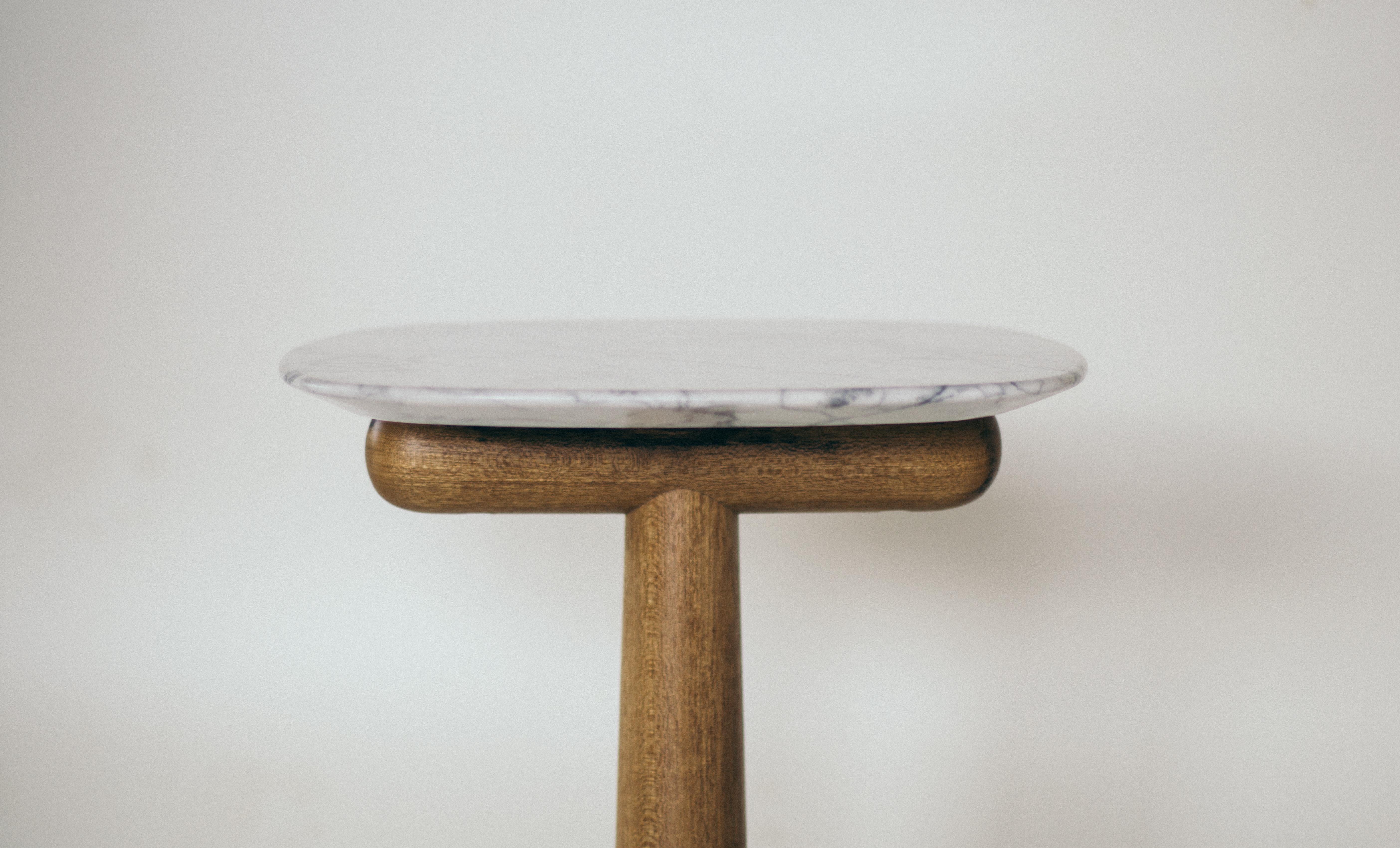 Blondin is a side or auxiliary table, ideal to support sofas and armchairs. It has the base in solid wood and the top in Carrara marble (or stone the customer's choice).