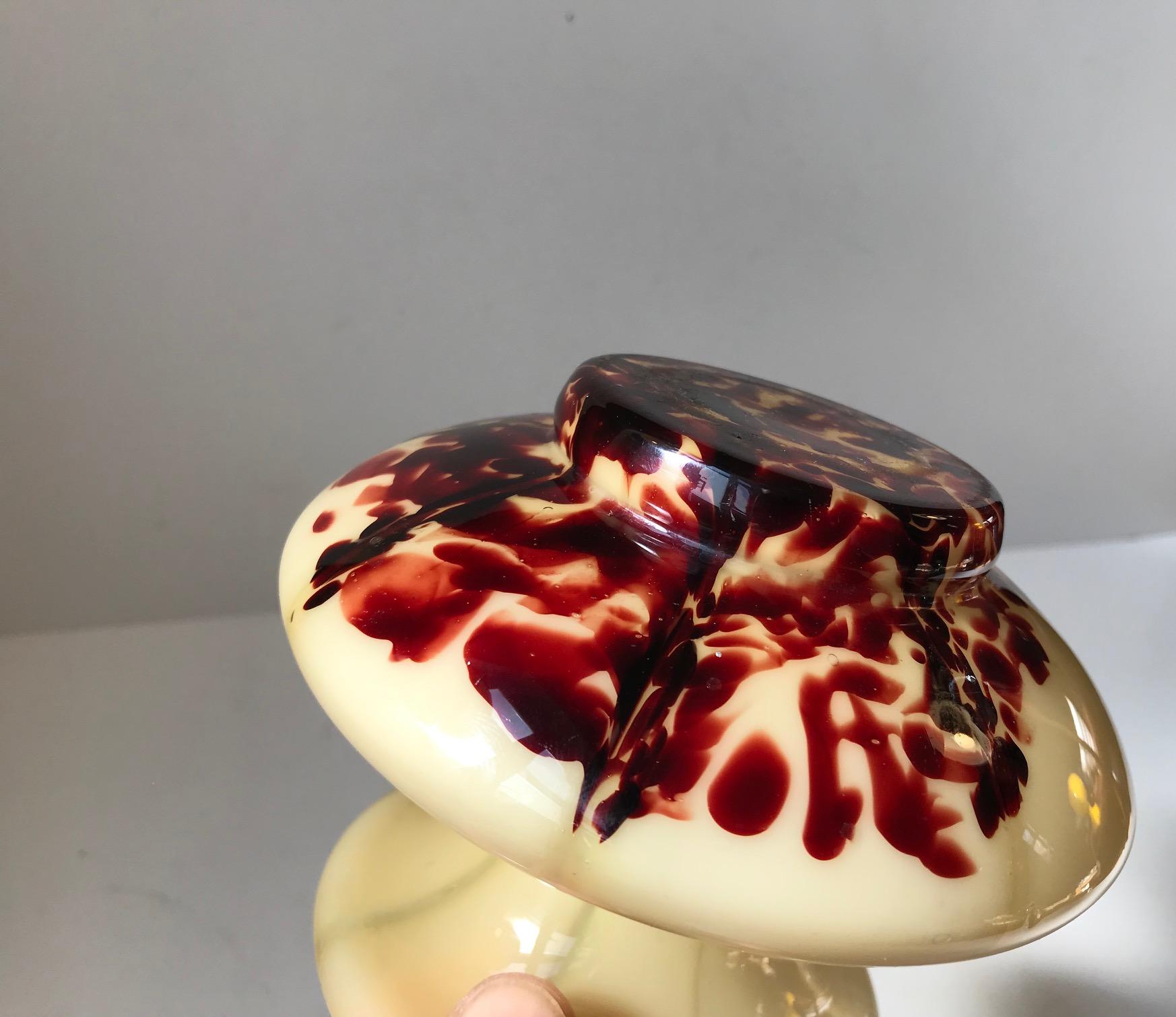 Unusual art glass vase with with optical stribes and blood splatter. Manufactured by Wilhelm Kralik und Sohne in Bohemia during the 1920s or 1930s.