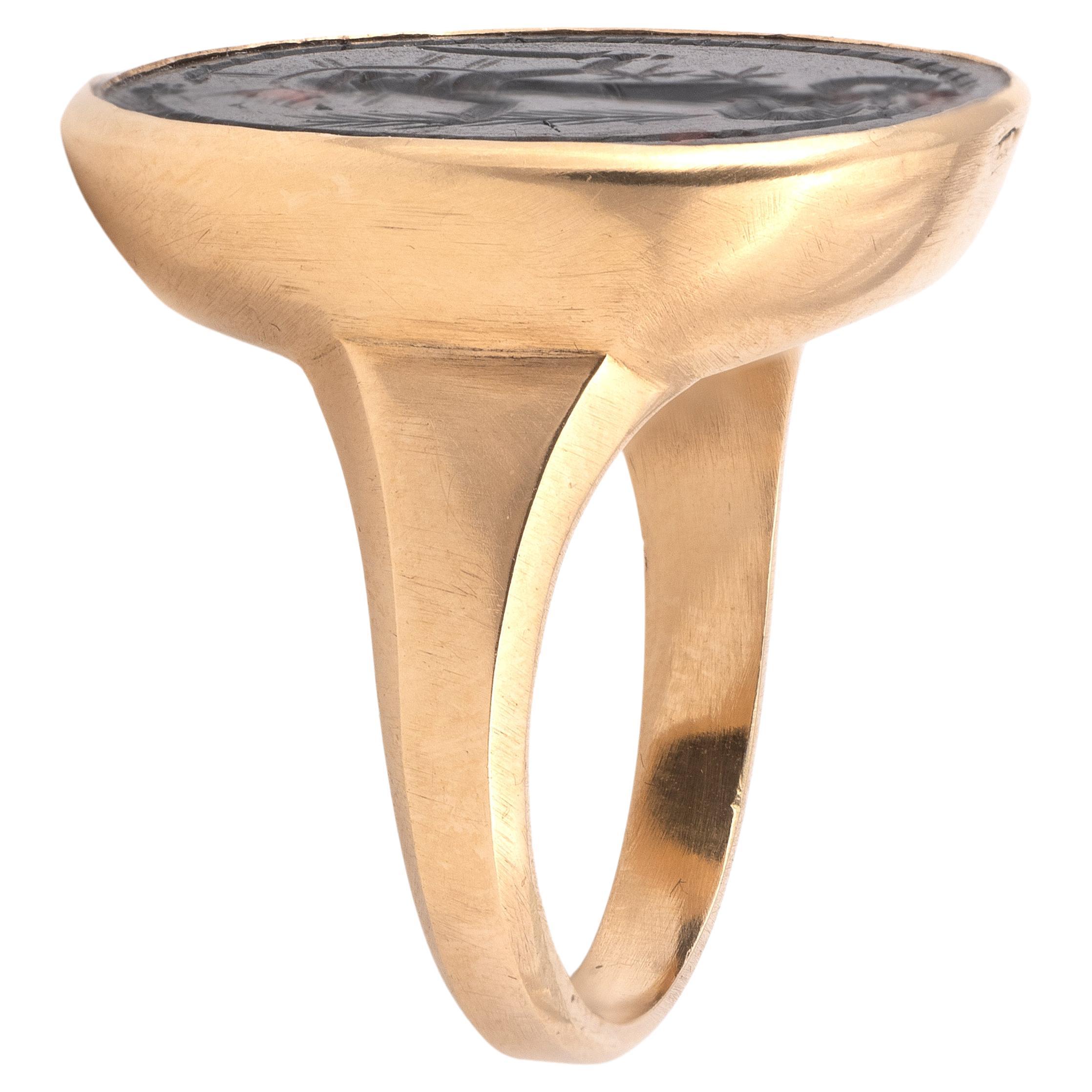 18kt yellow gold ring decorated with a bloodstone intaglio representing Abraxas in the form of a leontocephalic anguipede, holding a palm and a knife.
Group of roman magic intaglios. 2nd - 3rd century AD for the intaglio.
Dimensions of the intaglio: