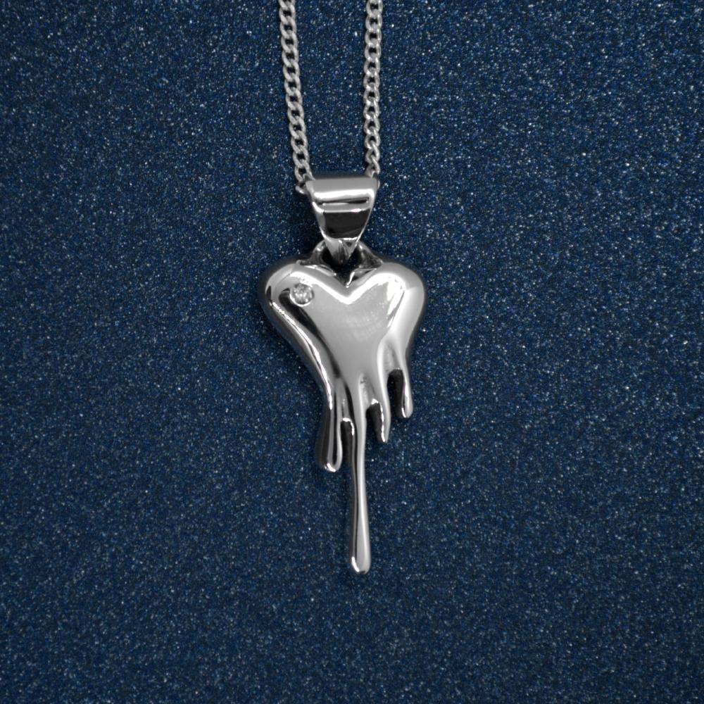 Made to order mini Bloody Heart Necklace, featuring a diamond, includes pendant and chain.

Our signature piece with a sparkle.

Made in 14k gold
Featuring a diamond .02 carat, 1.5 mm diameter
Dimensions W14 mm x H20 mm
Chain length 20”
5 grams

The