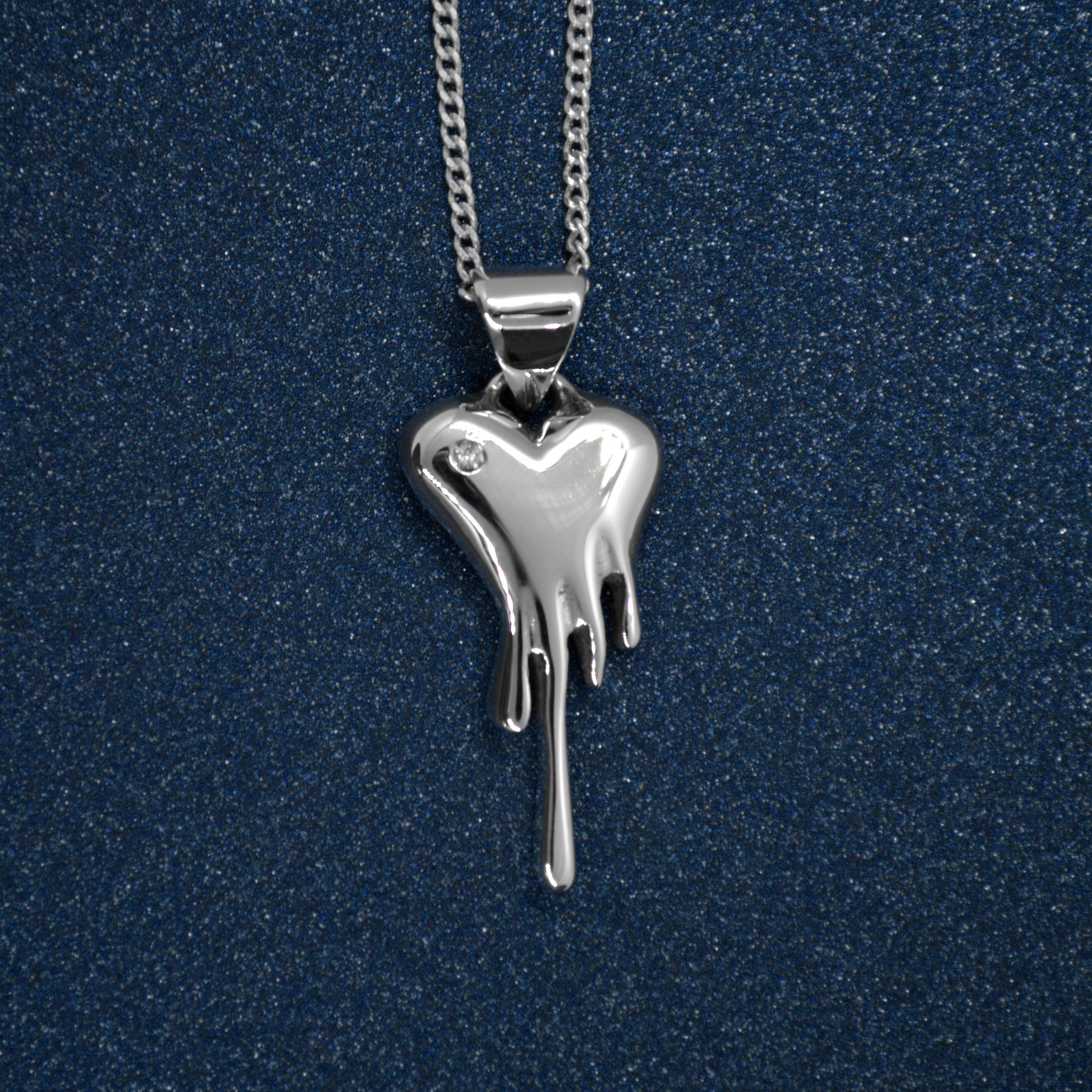 Made to order mini Bloody Heart Necklace, featuring a diamond, includes pendant and chain.

Our signature piece with a sparkle.

Made in Sterling Silver
Featuring a diamond .02 carat, 1.5 mm diameter
Dimensions W14 mm x H20 mm
Chain length 20”
4