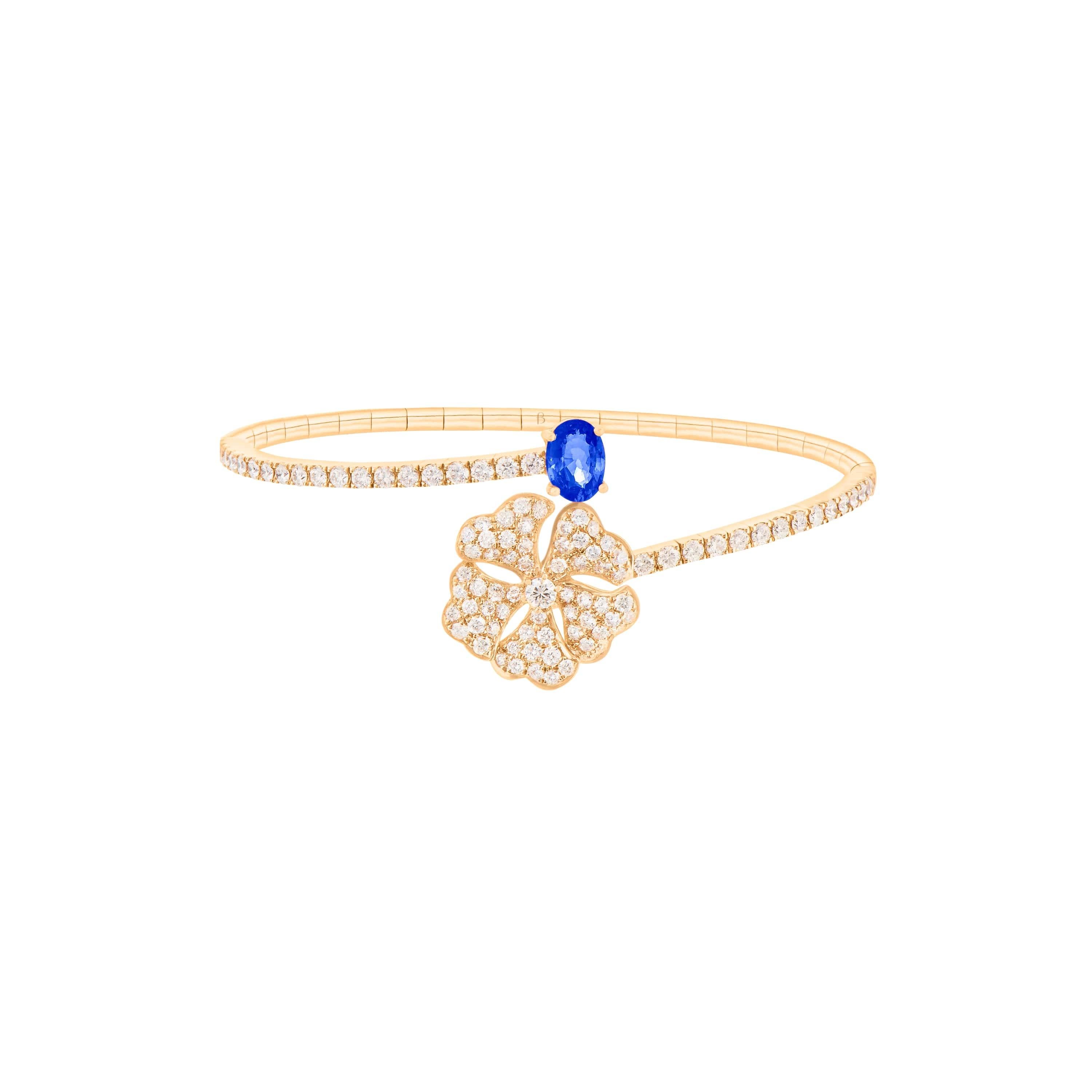 Bloom Blue Sapphire and Diamond Open Spiral Bangle in 18K Yellow Gold

Inspired by the exquisite petals of the alpine cinquefoil flower, the Bloom collection combines the richness of diamonds and precious metals with the light versatility of this