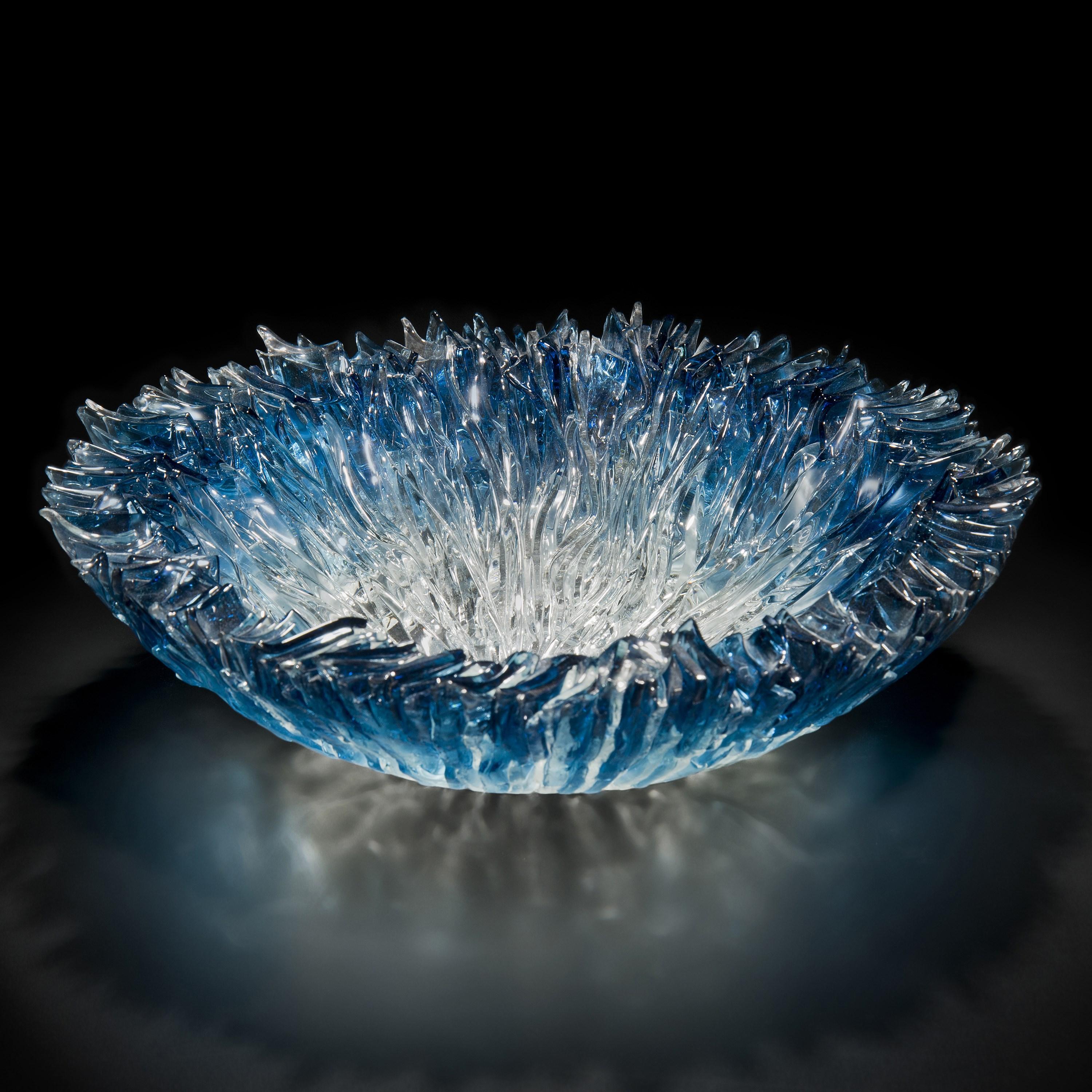'Bloom Bowl in Aqua' is a unique sculptural centrepiece created by the British artist, Wayne Charmer.

For Wayne Charmer, the fascination of glass is to exploit its translucent and reflective qualities. Inspired by nature, his signature techniques
