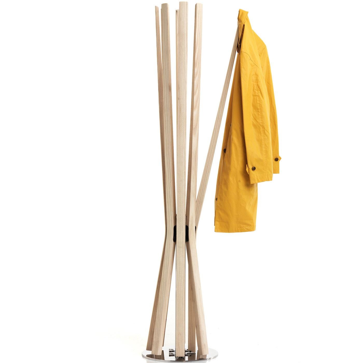 Merging striking aesthetic with a dynamic design, this coat rack is an elegant and functional piece of decor that will stand out in any interior. Designed by Jeff Miller in 2009, it has a chrome-finished steel frame supported by a stainless steel