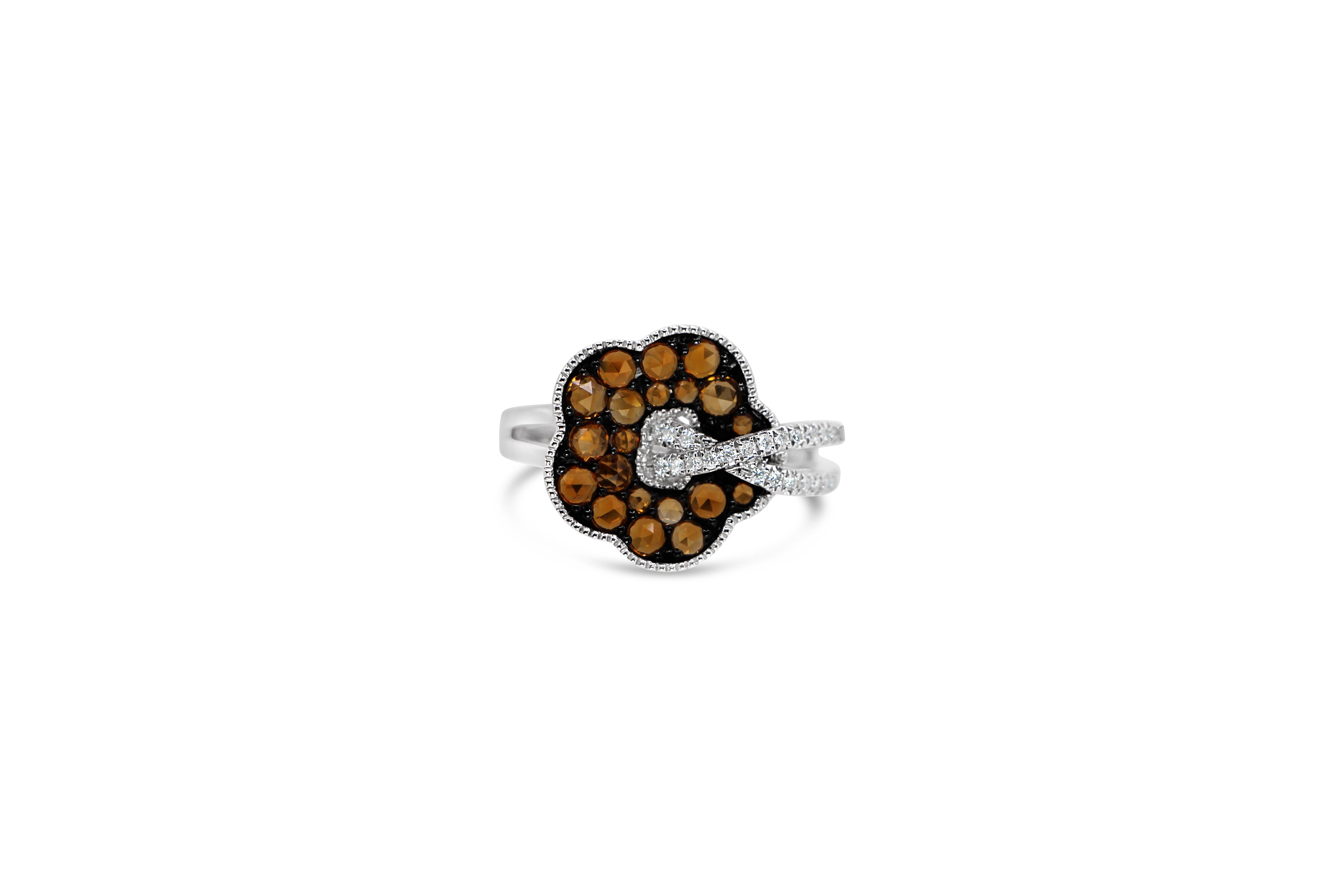 Bloom Flower Ring, in 18Kt White Gold, with Double Pave Shank. This floral ring is decorated with Brown old cut diamonds snow pave setting and White brilliant cut 
The brown diamonds are 0.95 ct and the white diamonds are 0.16 ct all set in pave