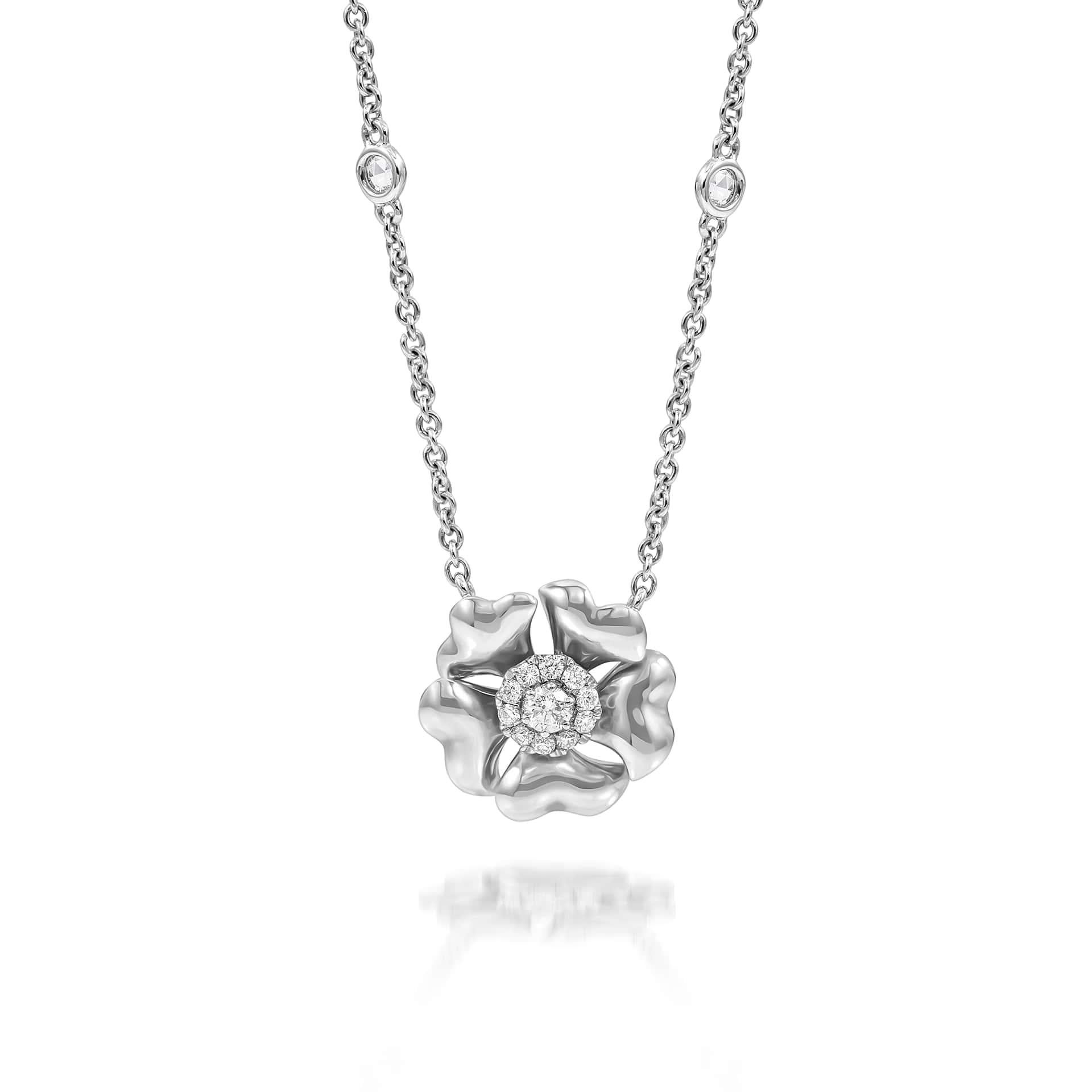 Bloom Gold and Diamond Flower Halo Necklace in 18K White Gold

Inspired by the exquisite petals of the alpine cinquefoil flower, the Bloom collection combines the richness of diamonds and precious metals with the light versatility of this delicate,