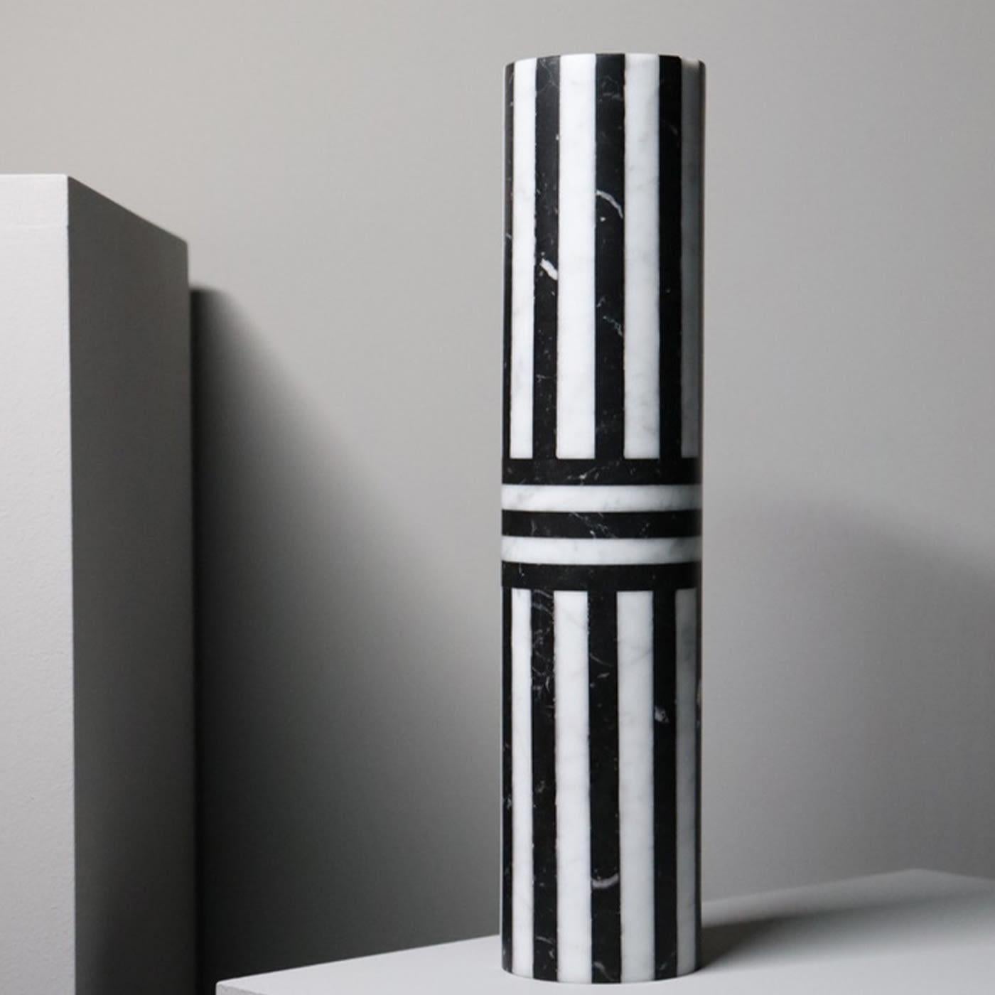 Introducing a new collection of vases, handcrafted in Italy from the highest quality stones. Bloom vases feature a solid cylindrical shape-enhancing striped pattern created by alternating white Arabescato and black Marquinia marbles. Conceived as a