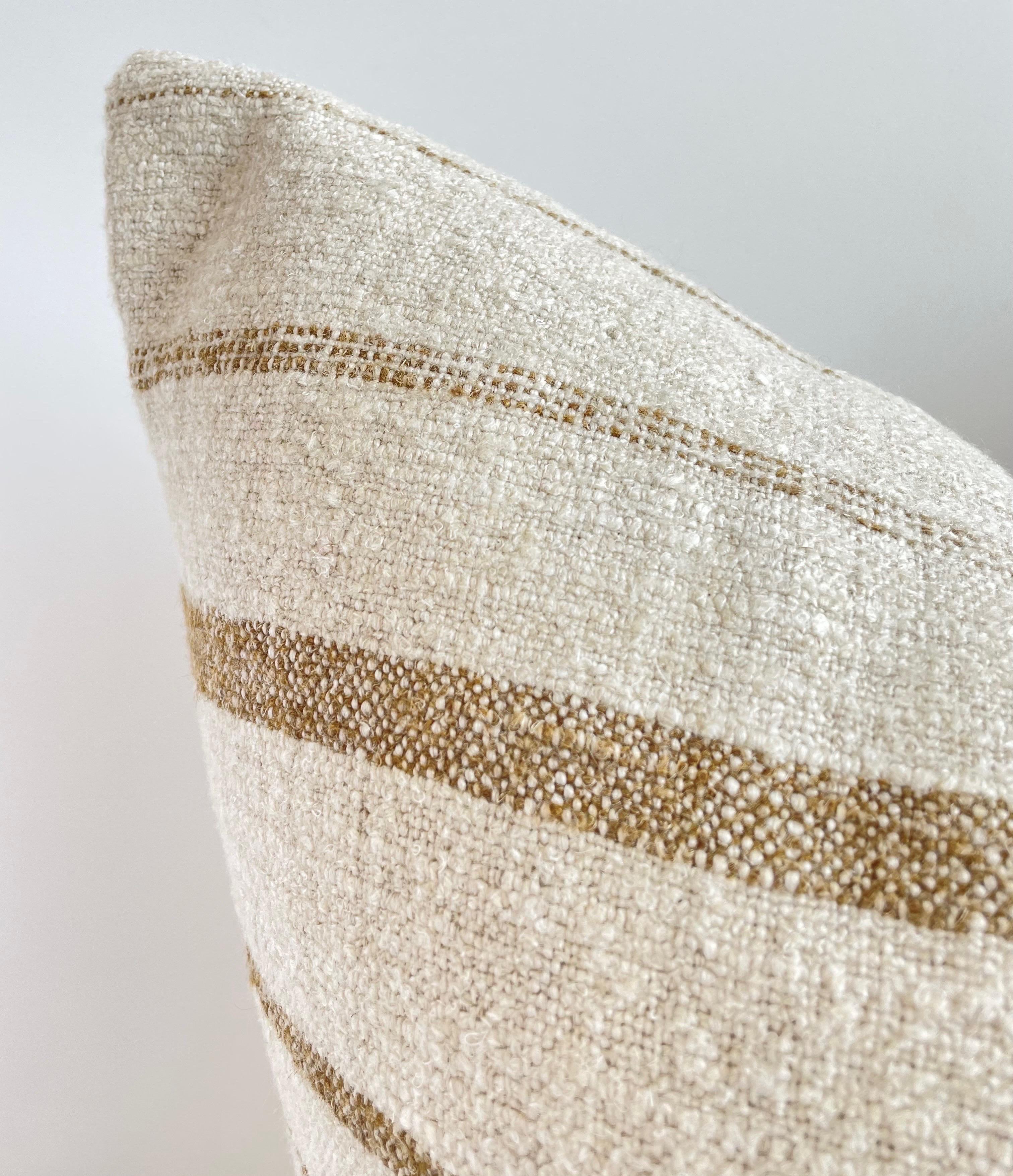 Woven in Belgium using traditional weaving techniques, Bloom Home Inc. Natalie features a Belgian Linen warp and alternating Belgian Linen/Mixed Fiber weft. This pillow feature a horizontal non repeating stripe. Includes insert. 

Color: Natural and