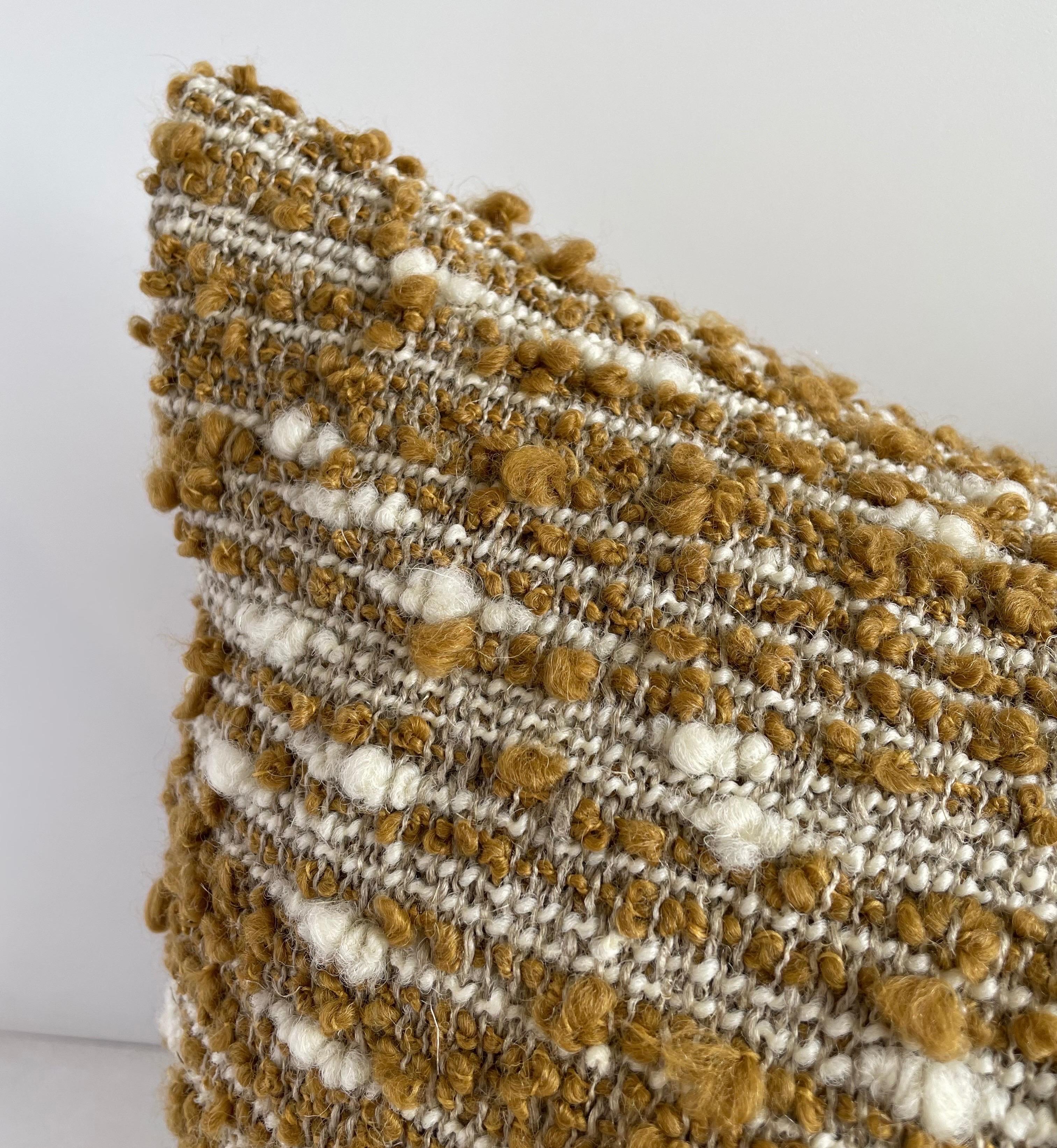Woven in Belgium using traditional weaving techniques, Bloom Home Kim is a medium weight throw that features a soft boucle yarn on linen warp. Includes insert. 
 
Color: Natural and Mustard 
Content: Linen 33%. Wool 28%. Acrylic 28%. Polyester 8%.