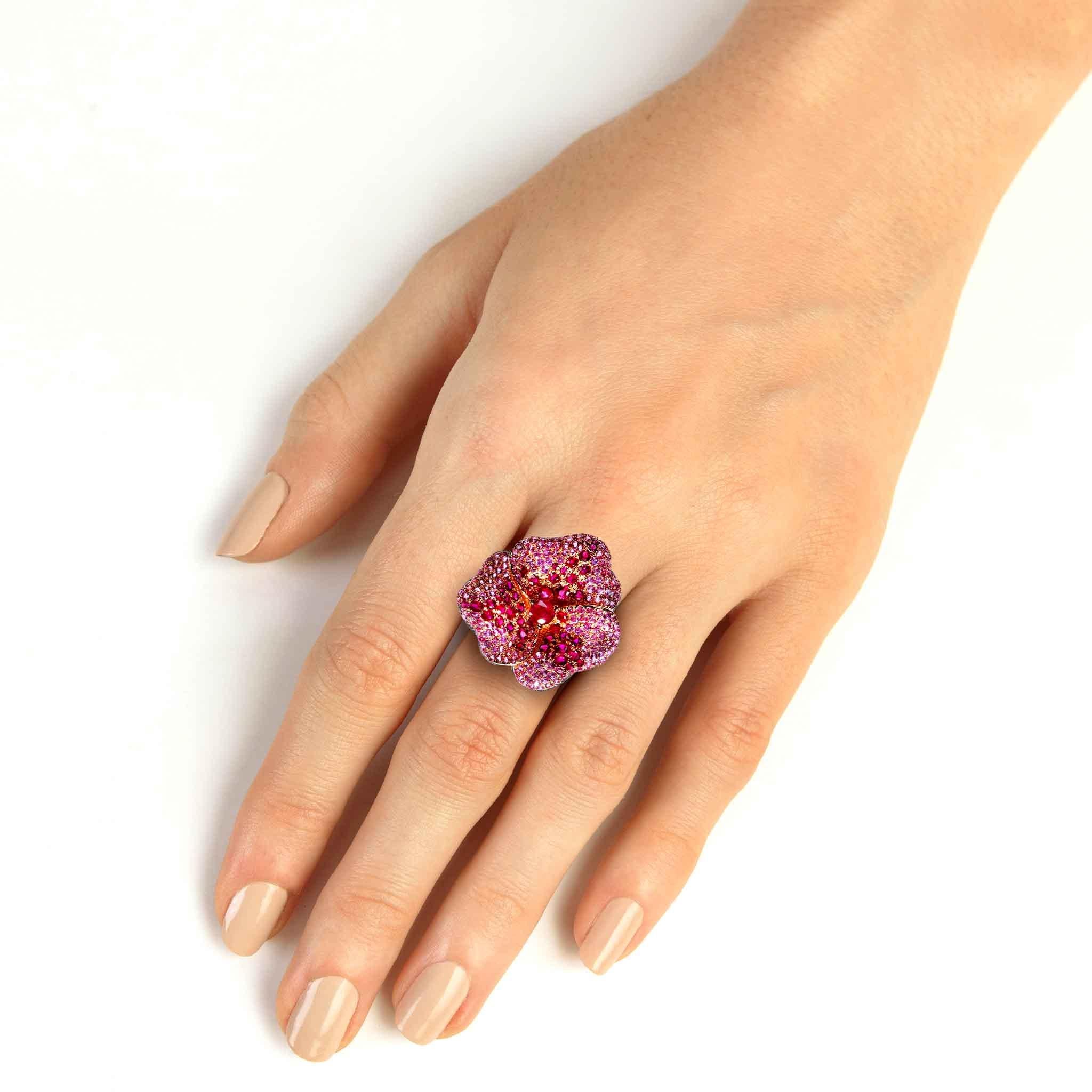 Looking for a truly stunning cocktail ring? This Large Flower Pink Sapphire Ring in Rose Gold is absolutely stunning, and perfect for making a statement. The 18K rose gold is beautiful and unique, and the pink sapphires are just gorgeous. This ring