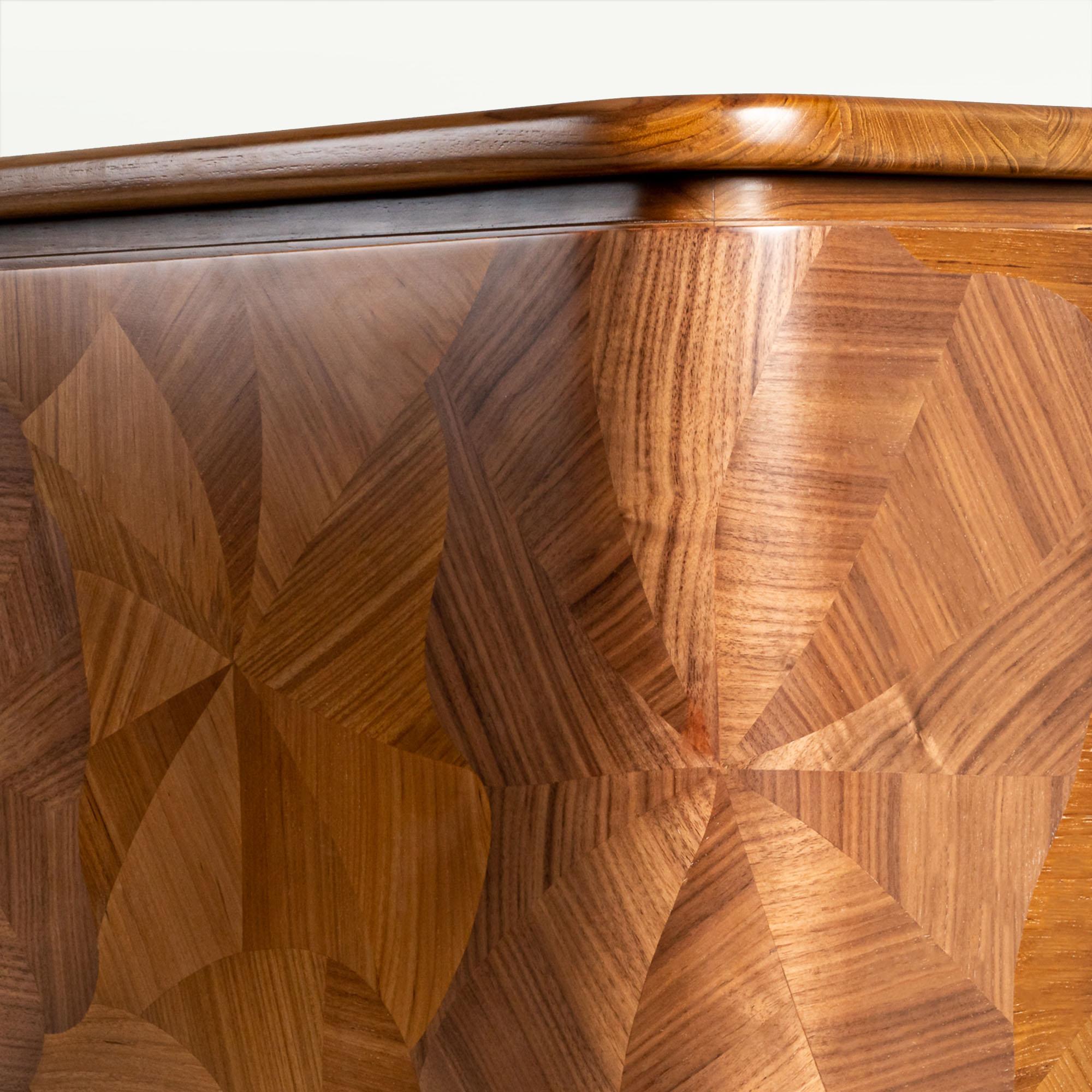 A centerpiece in any space, the Bloom Cabinet is crafted from a combination of teak and walnut, creating a beautiful contrast. Inspired by hibiscus flower, each petals are brought to life with ancient art of marquetry, hand pieced together to create