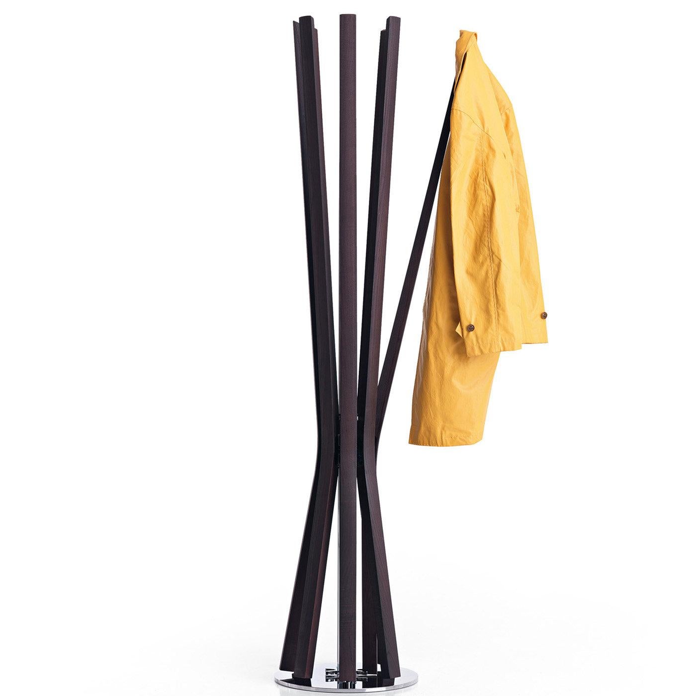 Conveying a strong visual appearance in a light and harmonious silhouette, this coat rack designed by Jeff Miller will be a stunning addition to a modern entryway or office. The simple yet elegant silhouette is extremely functional, with a