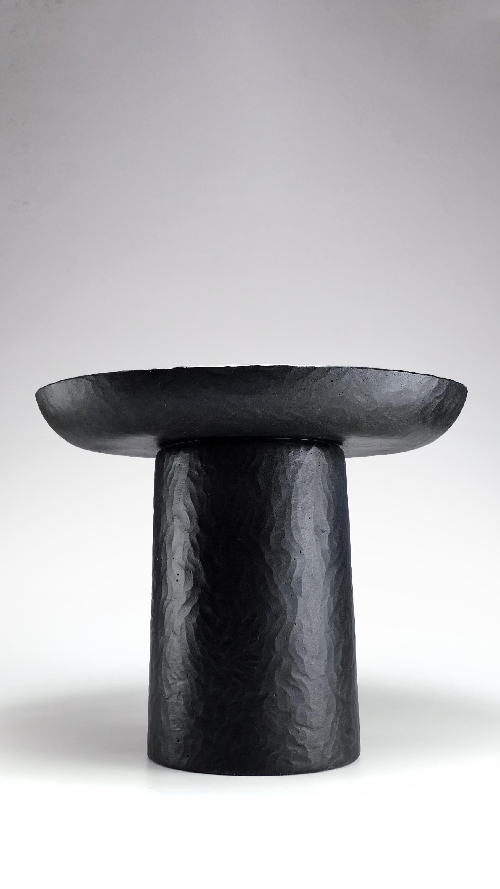 Minimalist Bloom Sculpted side table in Black Cast Stone by Alentes Atelier For Sale