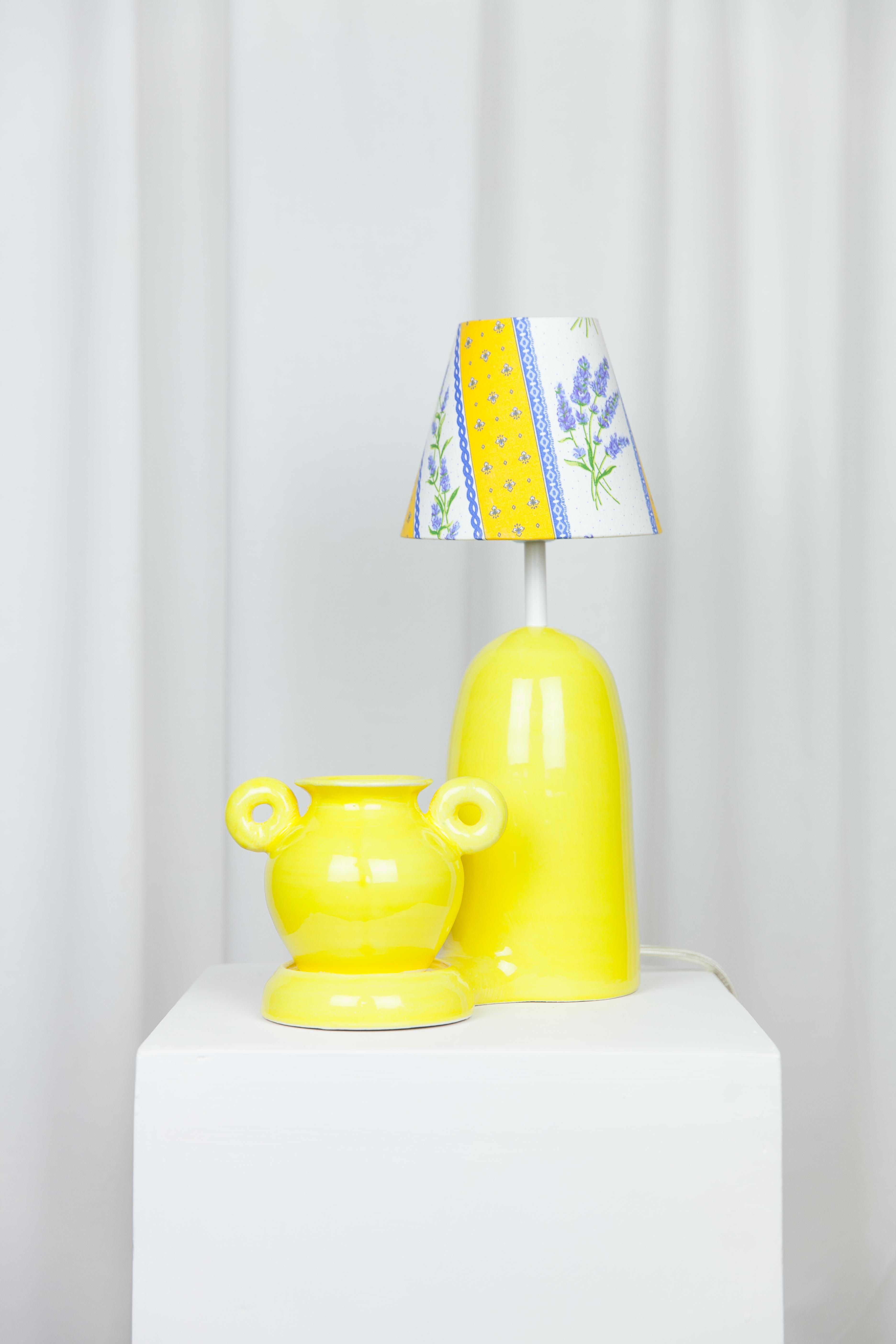 Bloom Terracotta lamp + vase by Lola Mayeras
Dimensions: D25 x W17 x W40 cm
Materials: Earthenware.

Lamp with detachable vase, white earthenware, glazed in yellow.
This piece is designed and handcrafted in the south of France.

All our lamps
