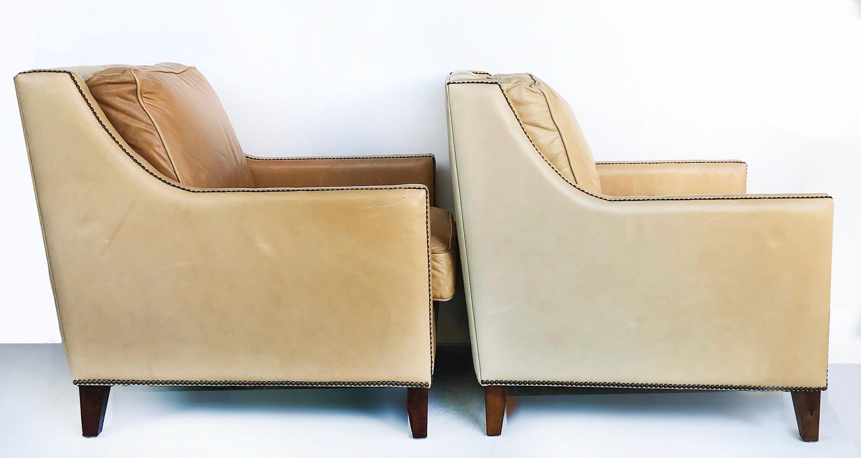 Bloomingdale's Elite leather club chairs, brass nailheads, a pair

Offered is a pair of vintage Bloomingdale's Elite Furniture leather club chairs in pale salmon tones. The tailored club chairs are finished with brass nailhead details and supported