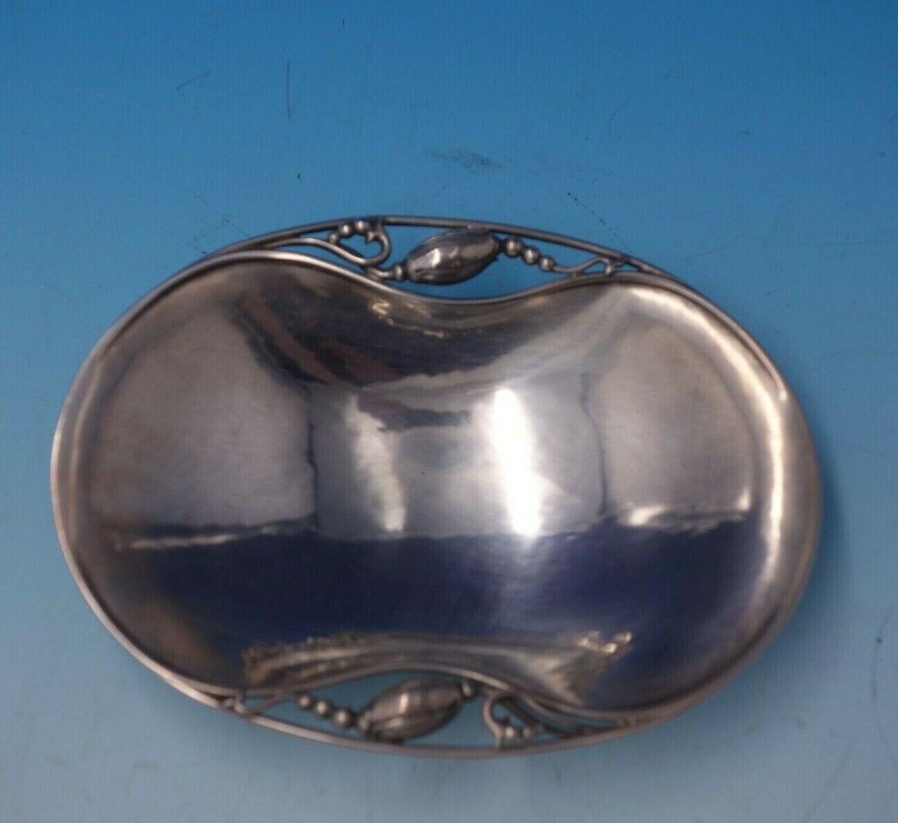 Blossom by Georg Jensen

Gorgeous Blossom by Georg Jensen sterling silver soap dished marked #2. This piece measures 7/8