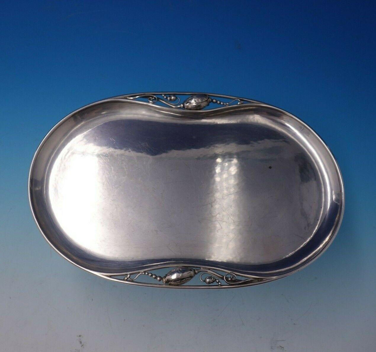 Blossom by Georg Jensen

Spectacular Blossom by Georg Jensen sterling silver oval tray marked #2P. This piece measures 3/8