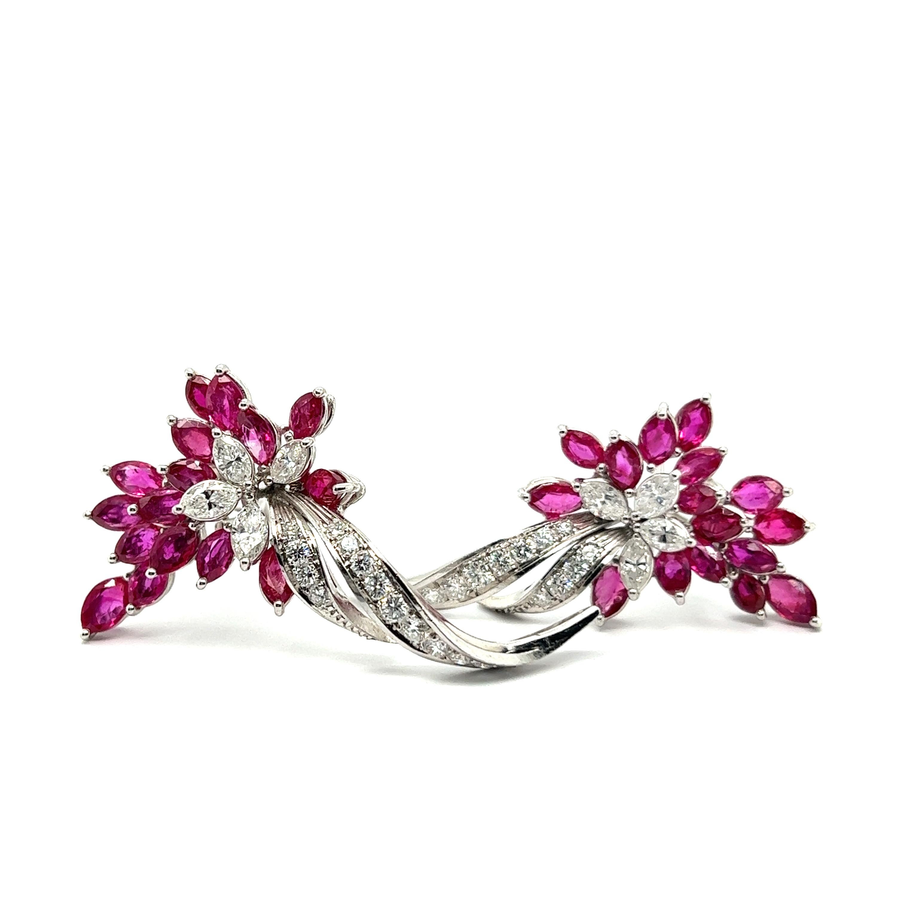 Introducing our exquisite rubies and diamonds clip-on earrings in 18 Karat white gold—an embodiment of jewelry artistry.

Seizing the spotlight, 32 exceptional marquise-cut rubies, totaling 7.00 carats that echo the grace of tropical blossoms. Their